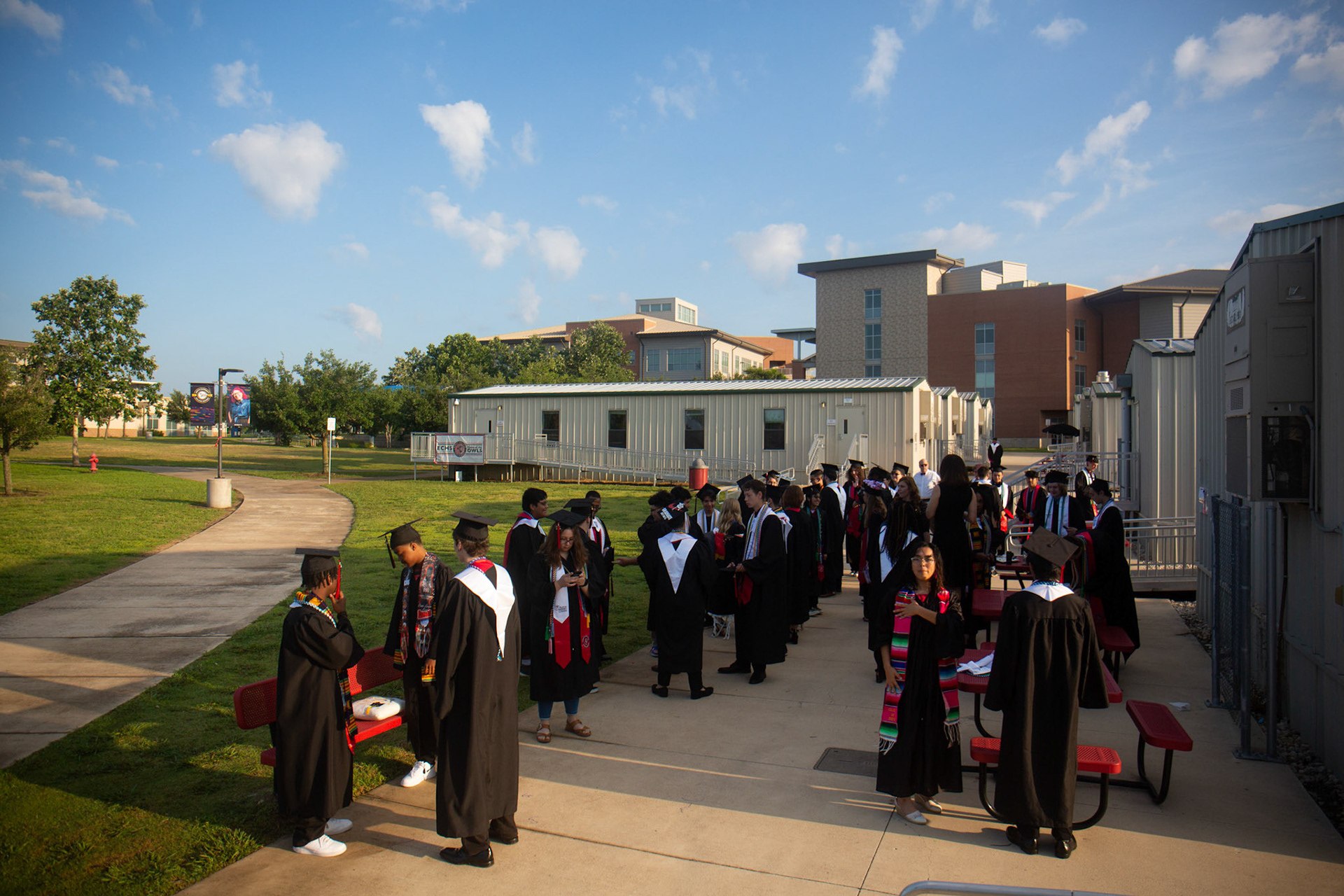 Topher Malone and her senior class wait to load buses to the event center the morning of graduation on May 26, 2023.