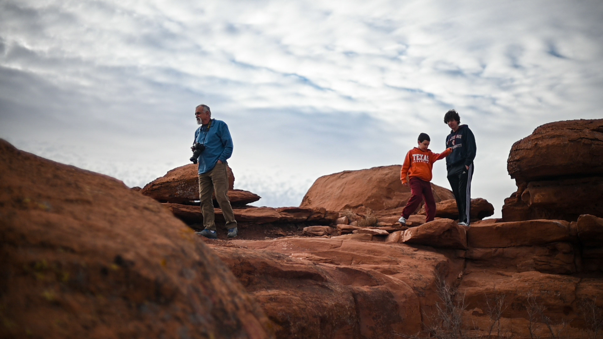 Precarious red rocks marked with dozens of white chalk names and muddied footprints; a pit stop we hit every trip.