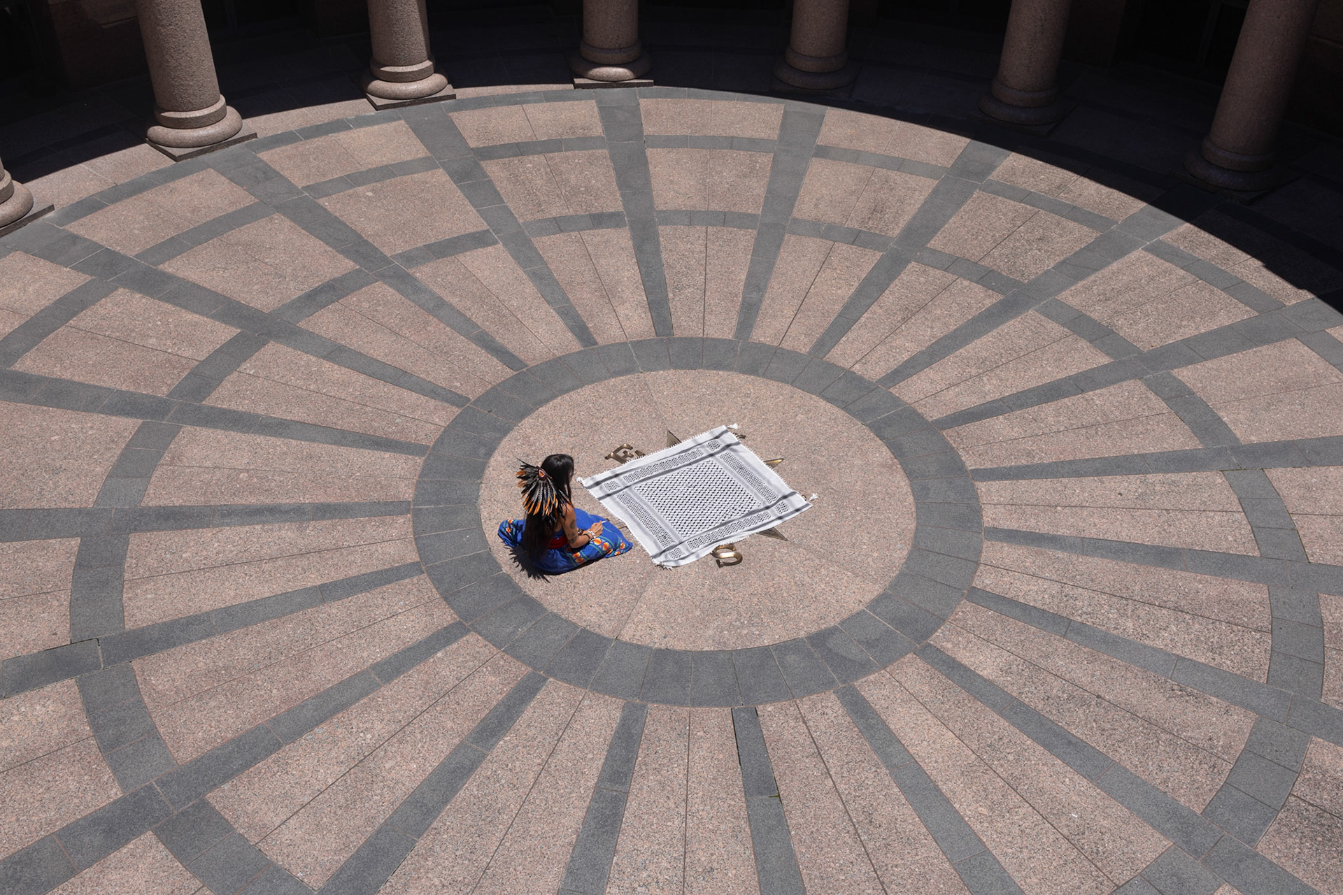 Two days after graduating UT-Austin, Kennedy Cortez sits outside in the capitol rotunda before testifying to the Texas Senate Subcommittee on Higher Education about permitting pro-Palestine demonstrations on campus on May 14, 2024. “It is an ethnic cleansing, an ethnic cleansing of a whole people exactly like the ethnic cleansing that happened to my people,” Cortez said, “the original people of these lands.”