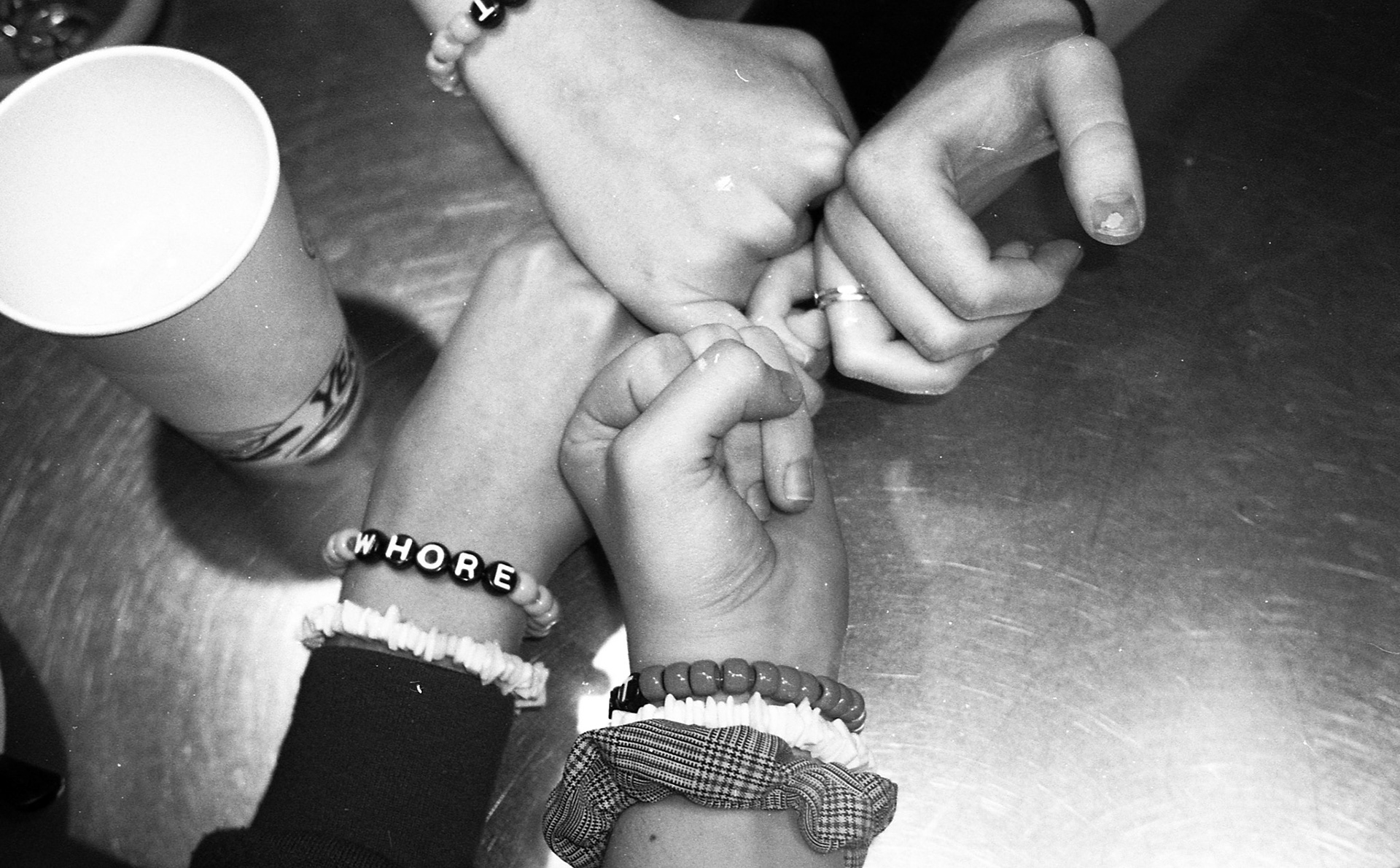 Me, Lydia, Sophie and Riley don our matching friendship bracelets at Chipotle, which read whore, slut and tramp, respectively.