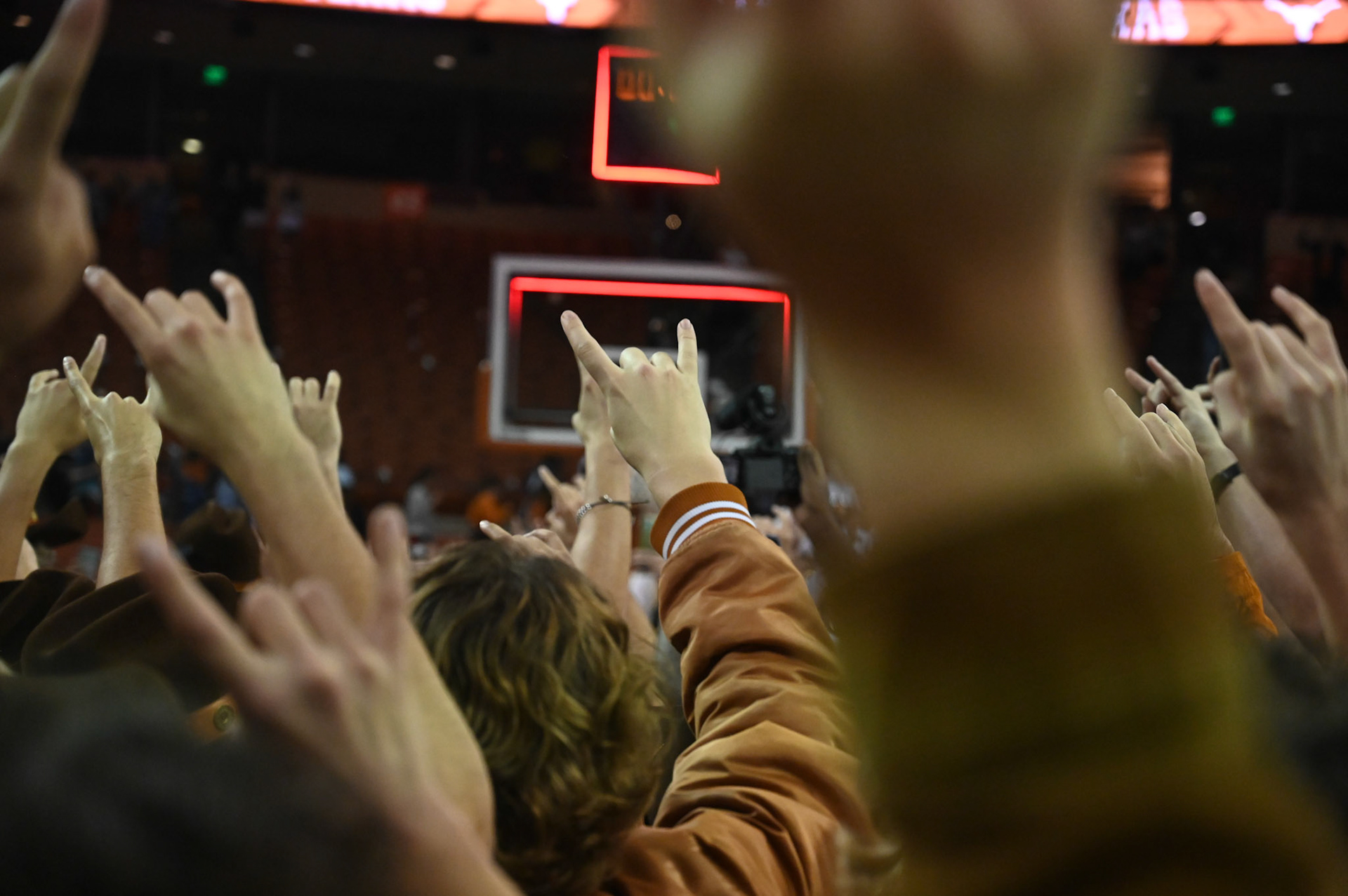 UT students hook 'em after winning the opening game against Houston Baptist on November 9, 2021. 