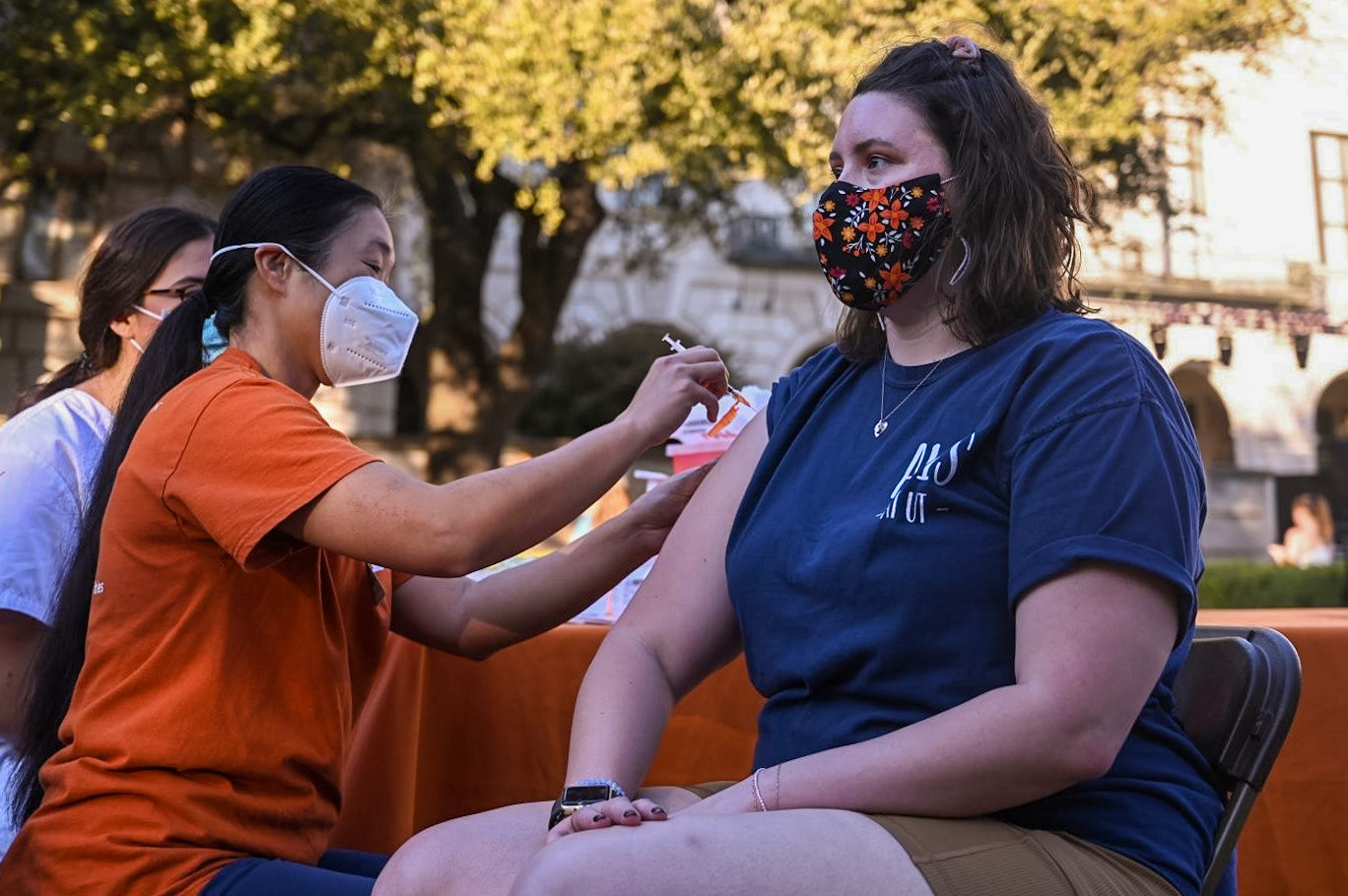 Christy Hjorth, a biochemistry graduate student who worked on protein expression and purification for HexaPro, receives her booster shot at the pop-up clinic held at the UT Tower main mall on November 18, 2021.  “It was incredibly rewarding working on it,” Hjorth said. “A lot of long hours and effort going into stuff, but it was really great seeing the translation from the bench to what is now going into all the health clinics.” 