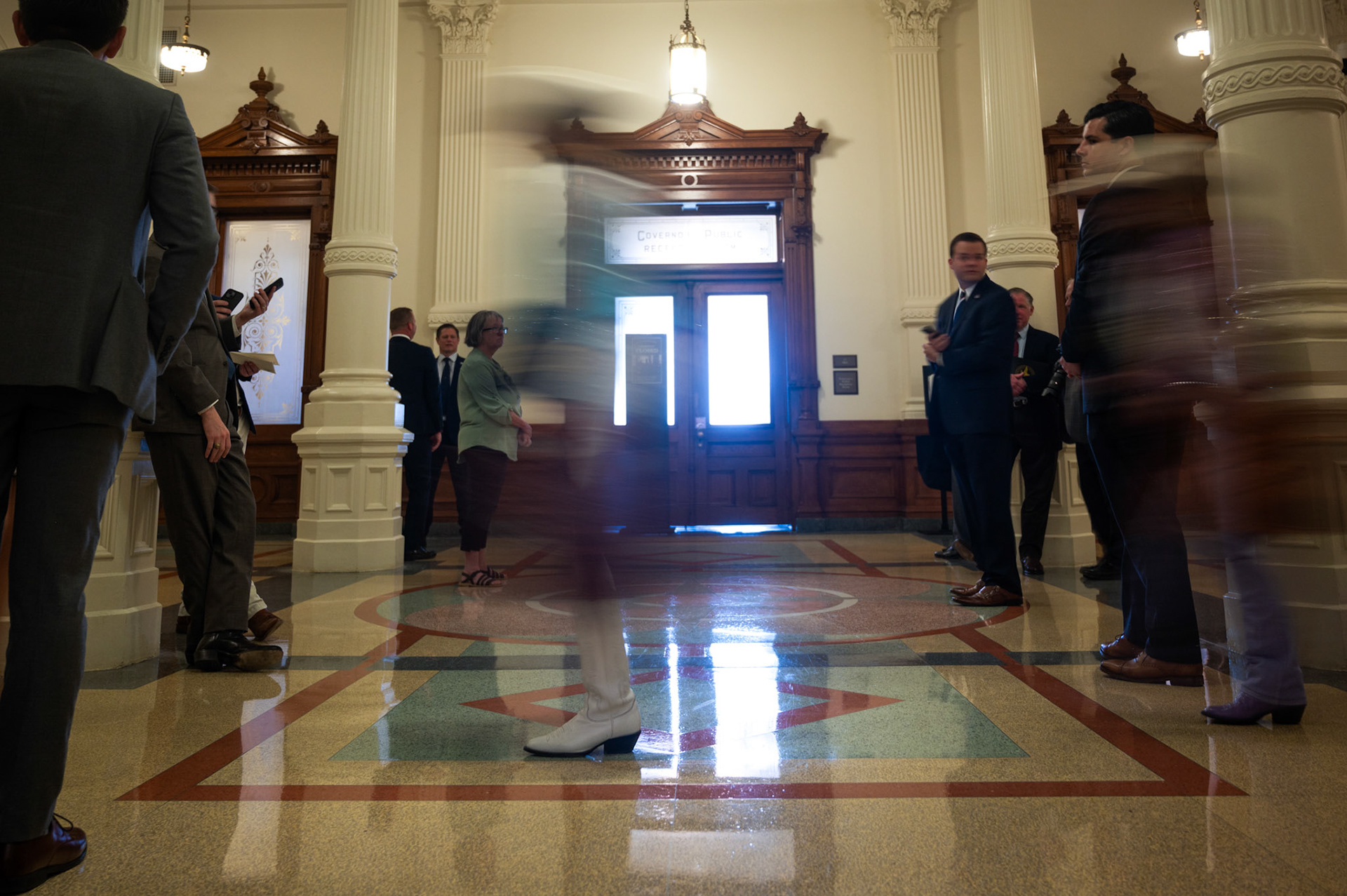 A crowd awaits former U.K. Prime Minister Boris Johnson after his visit with Gov. Greg Abbott in his office to discuss economic development on May 23, 2023. Gov. Greg Abbott hosts an economic development meeting with Former U.K. Prime Minister Boris Johnson in his office on May 23, 2023.