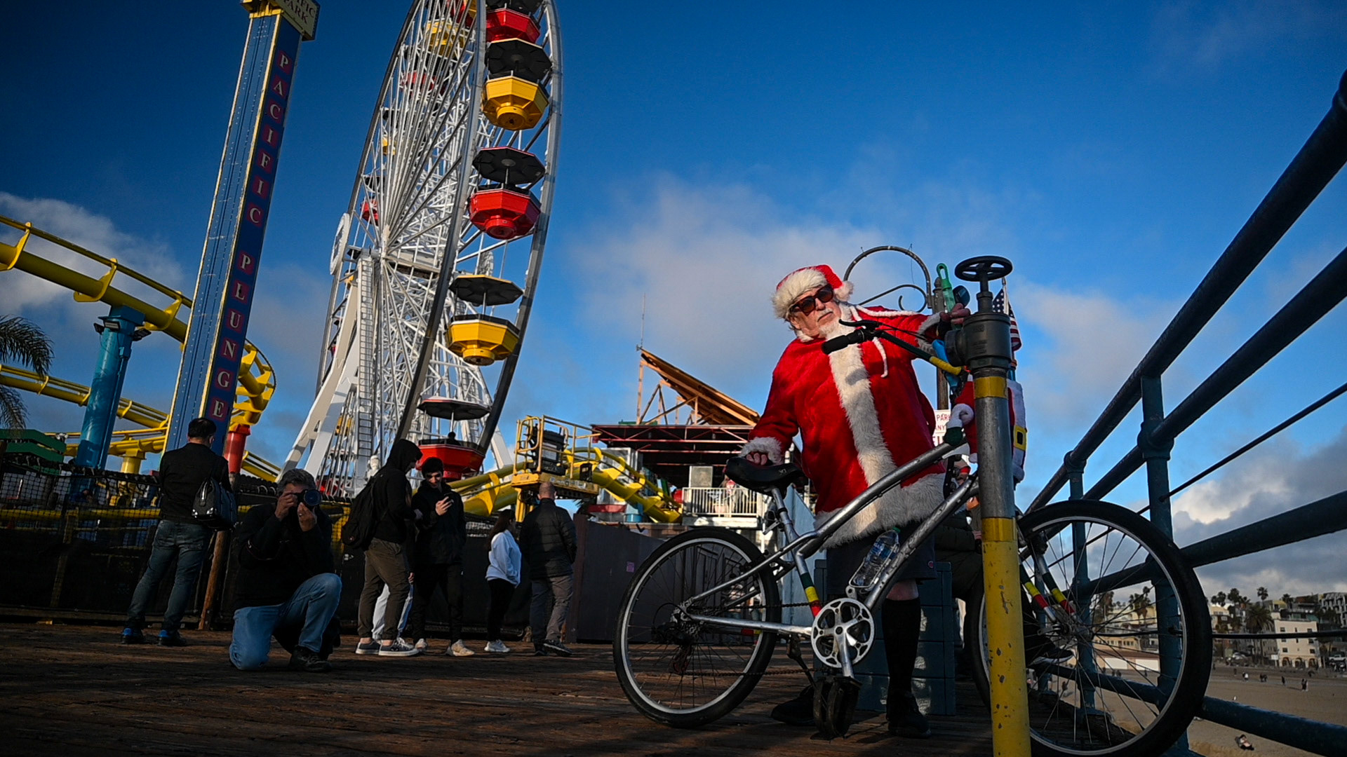 Santa (Monica) Claus blows bubbles on the pier. I am not the only photographer littering the beach. 