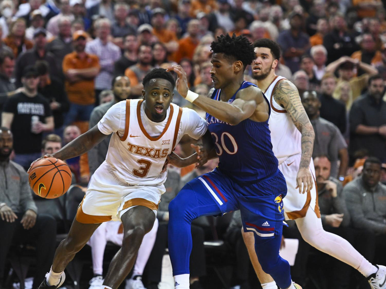 Senior guard Courtney Ramey sprints down the court at the game against Kansas on February 8, 2022.  Texas became the first team in the Big 12 to beat Kansas three times in a row in 19 years. Ramey was tasked with defending leading Kansas senior guard Ochai Agbaji and him to 11 points. 