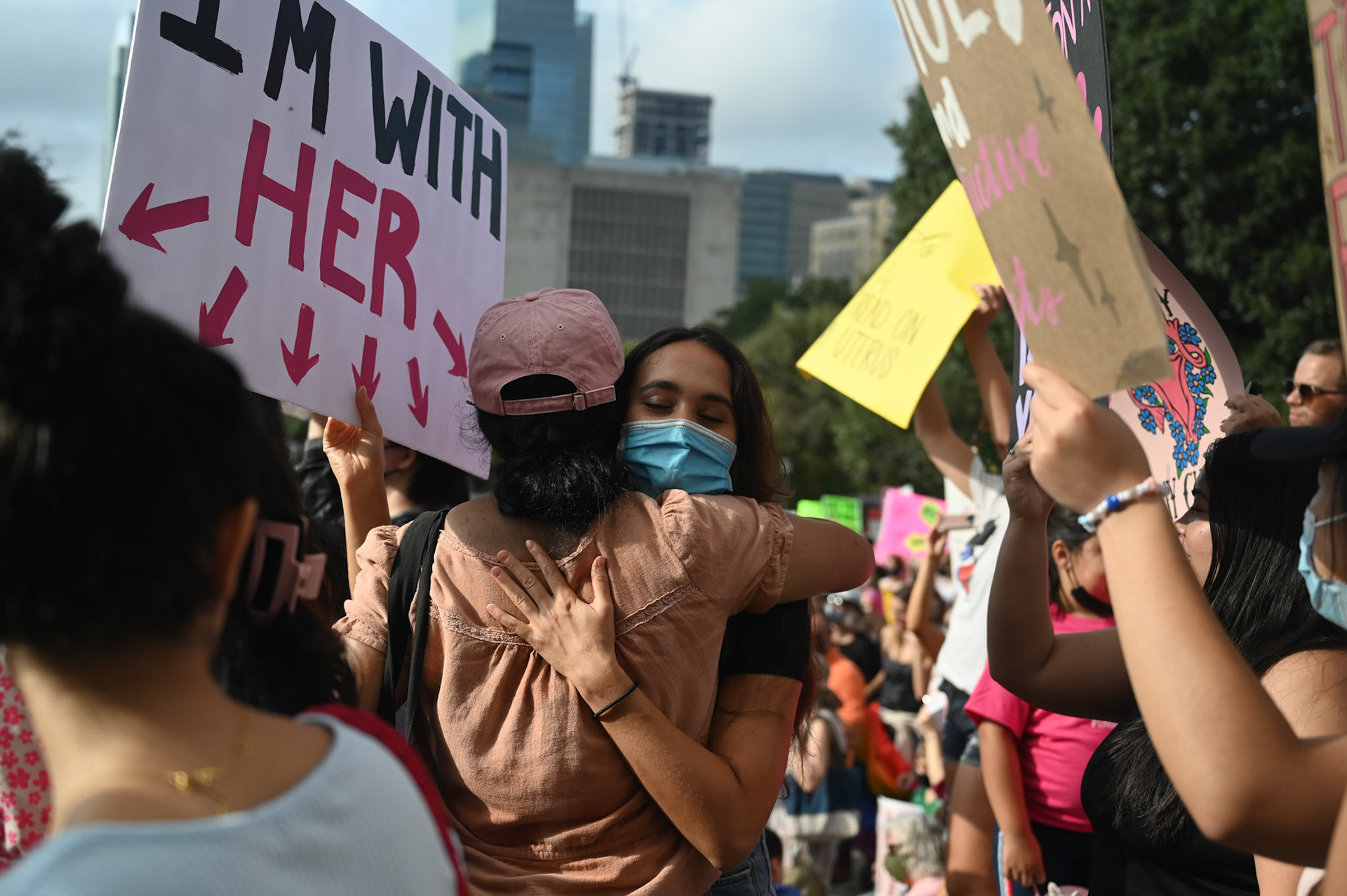 Two friends embrace at the Austin Women’s March on October 2, 2021. 