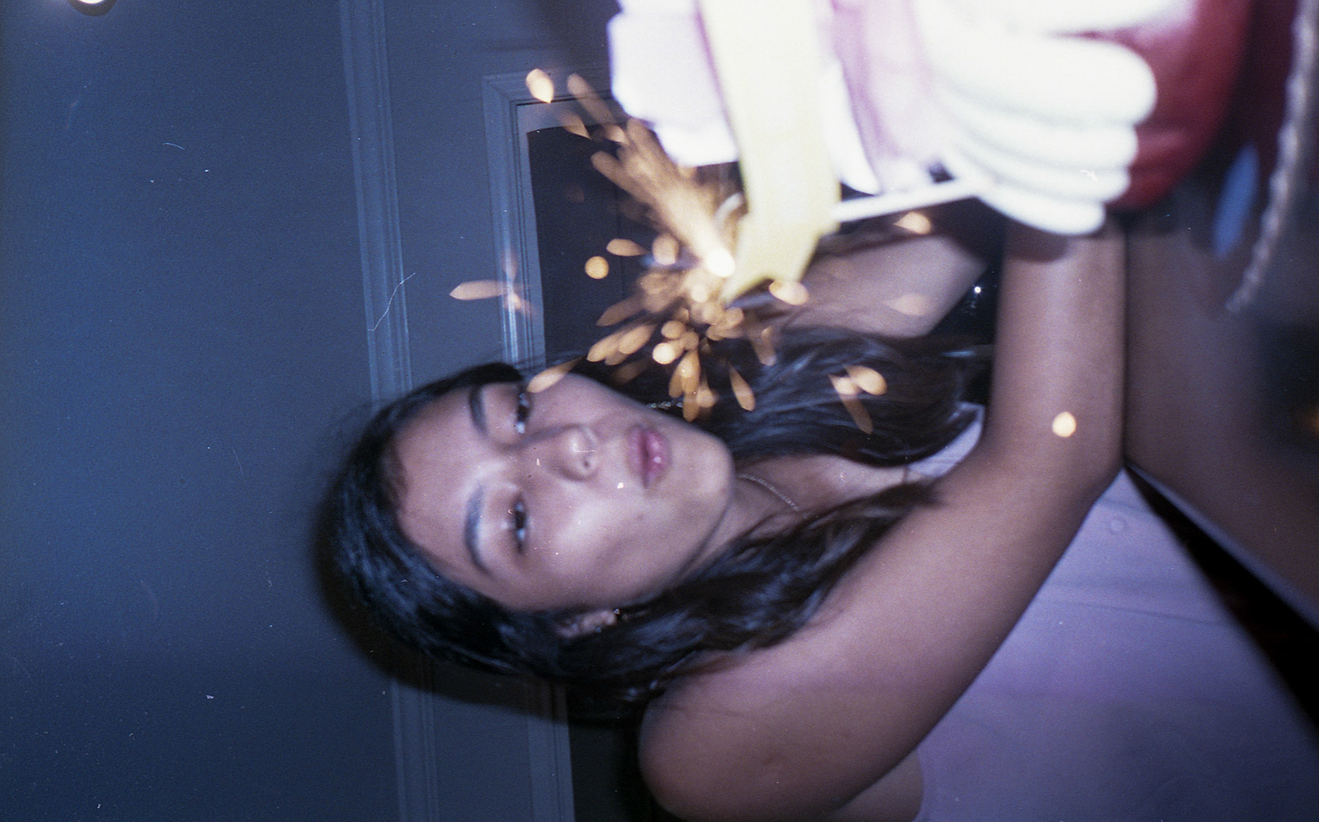 Andrea blows out the sparklers on her 16th birthday bundt cake.
