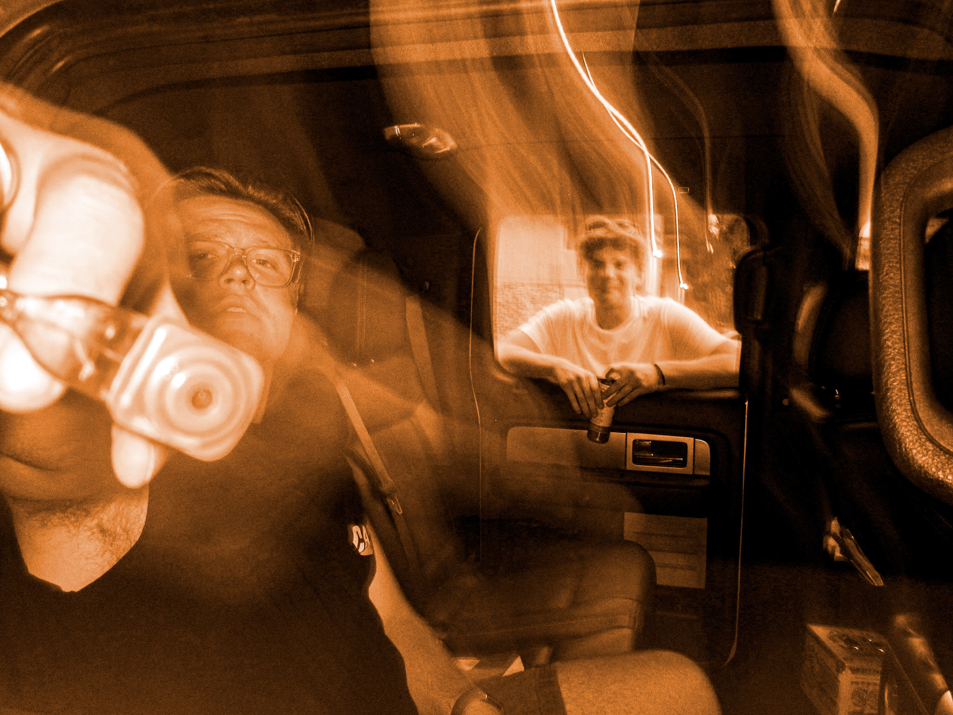 simon and alec hold a water gun and celsius energy drink, respectively. 2022.