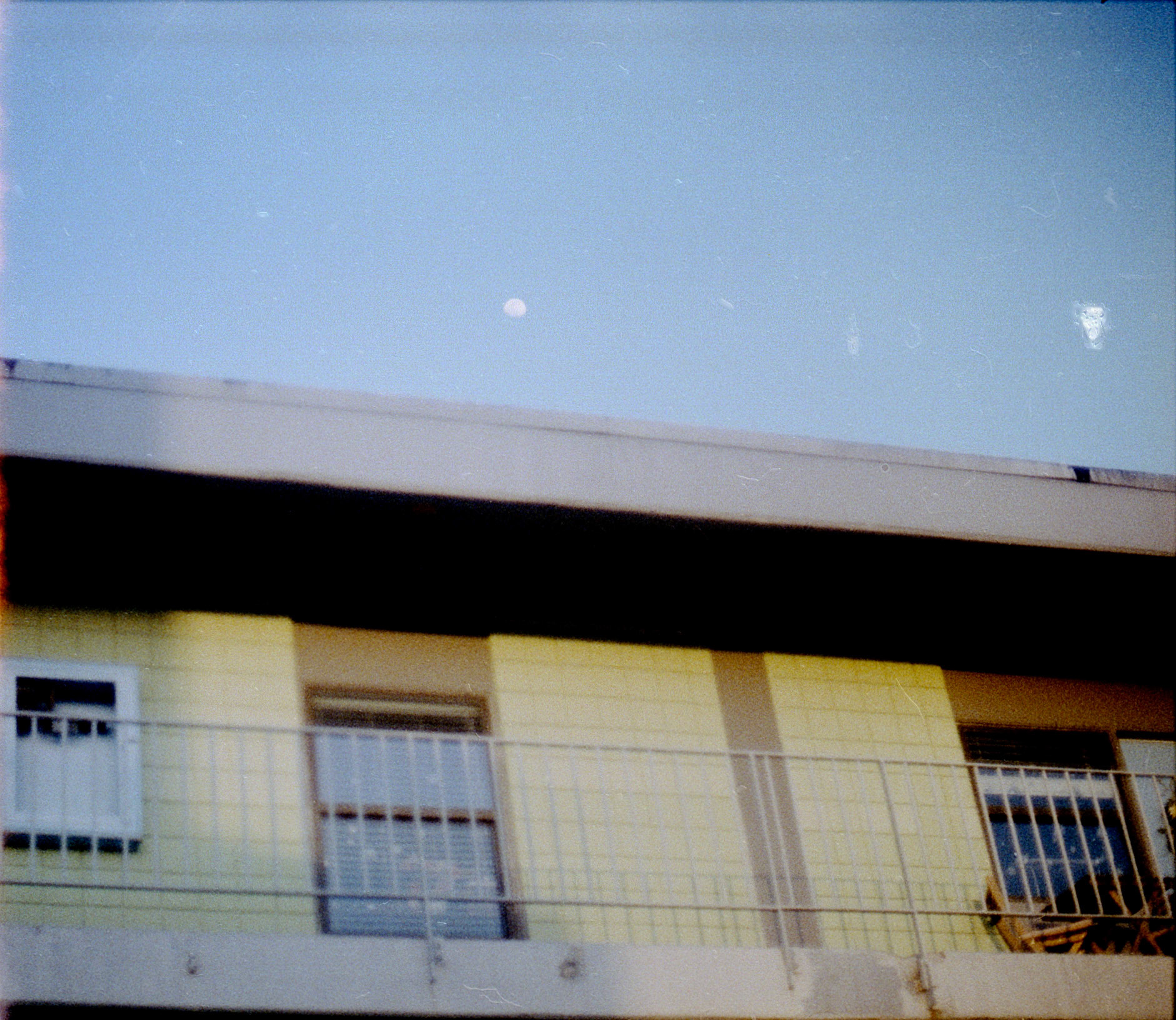 a view of the lone star apartment balconies from the pool. 2022.