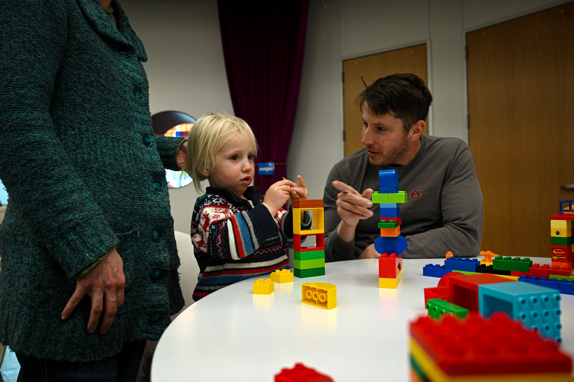 On day four without power, Justin Havird and Arlo, 2, build with legos at the Austin Central Library on Feb. 4, 2023.