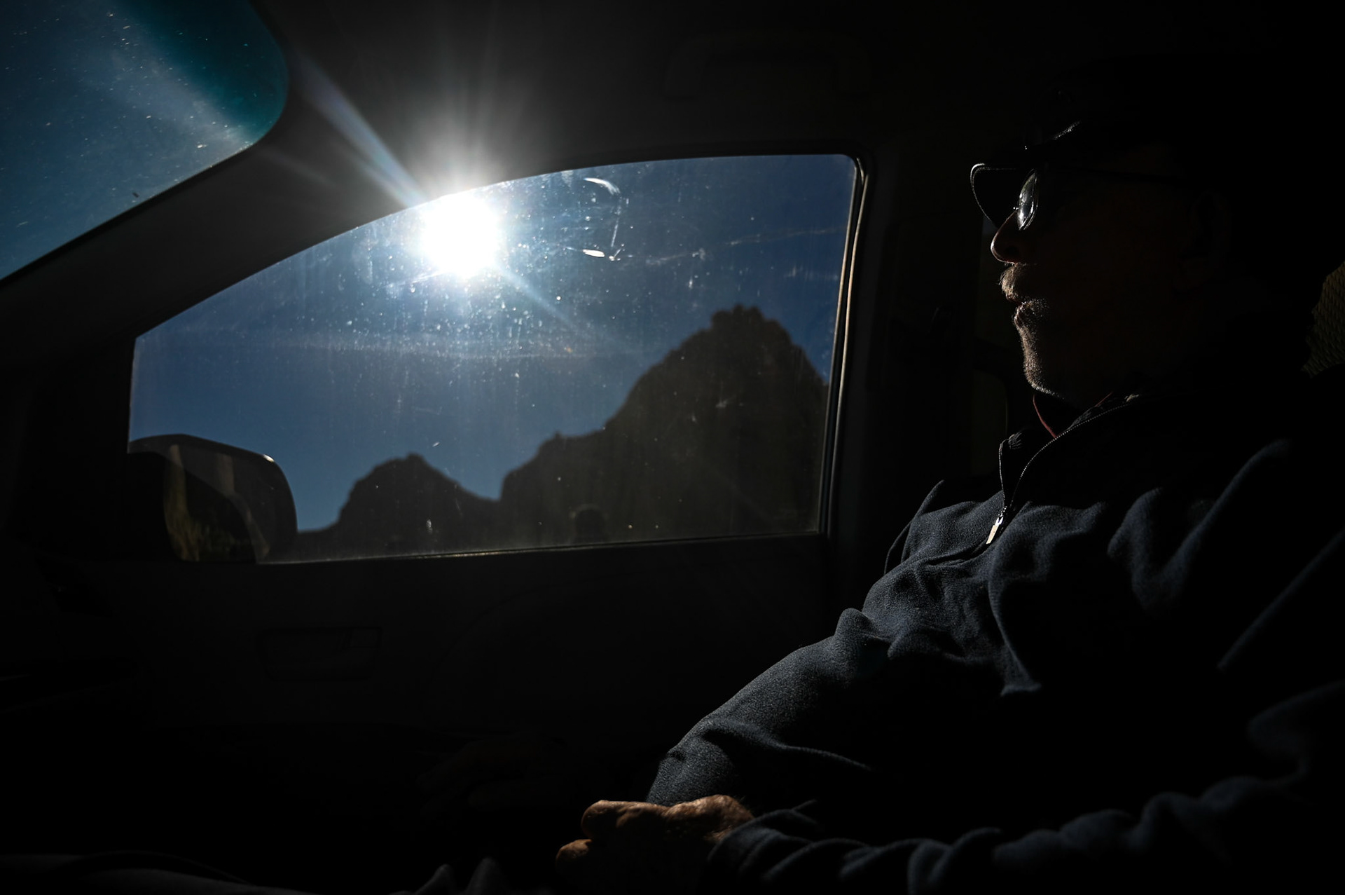 Grandpa Jim makes camp in the car while the family sets up tents outside. 2021.