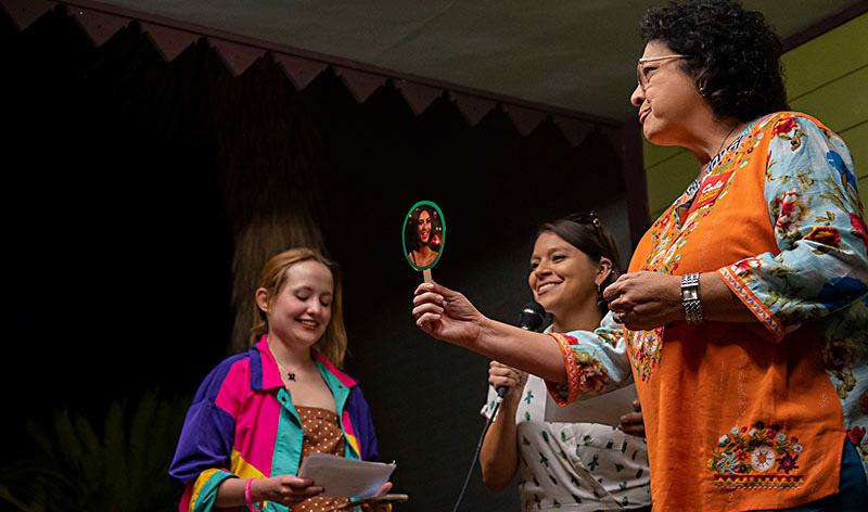 Austin mayoral candidate Celia Israel uses a happy-versus-crying Kim Kardashian cutout to answer questions about climate change at a youth candidate forum on Oct. 6, 2022.