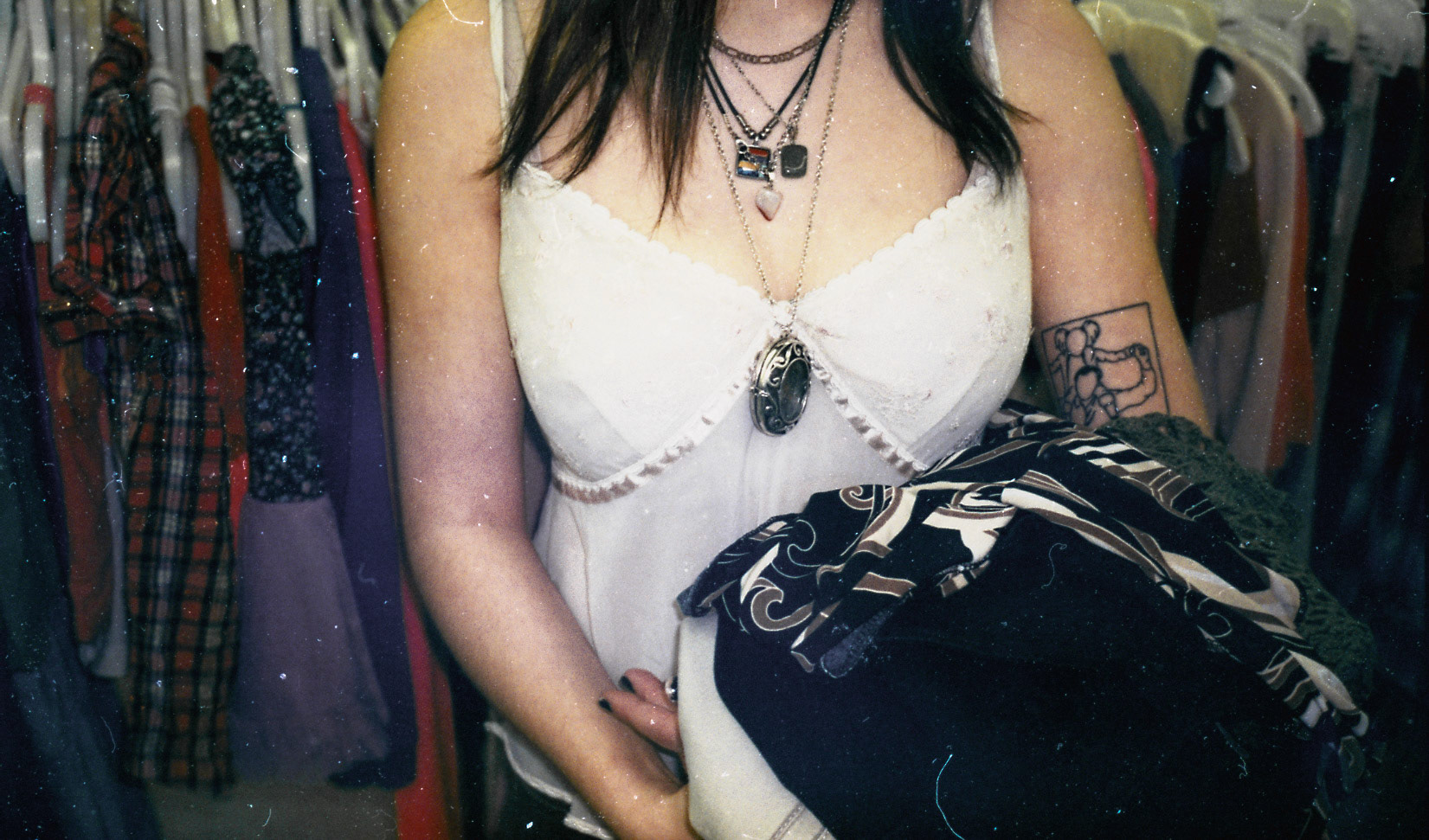 Sophie fills her freshly tattooed arms with thrift store finds at the now closed Family Thrift Center.