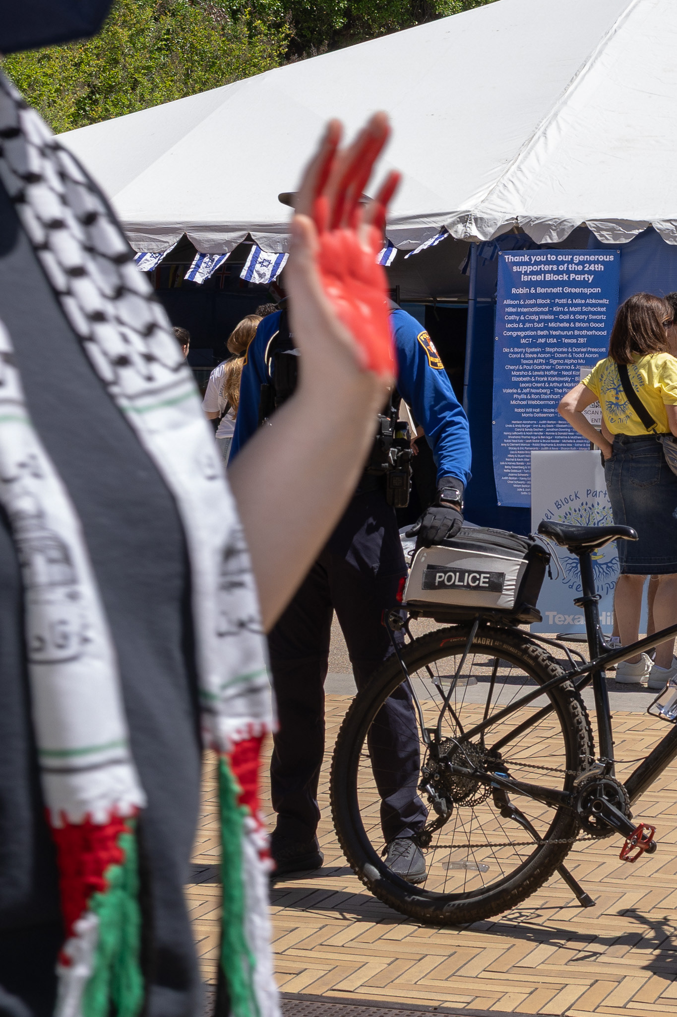 Protestors march silently down speedway during the annual Israeli Block Party at The University of Texas on April 2, 2024.
