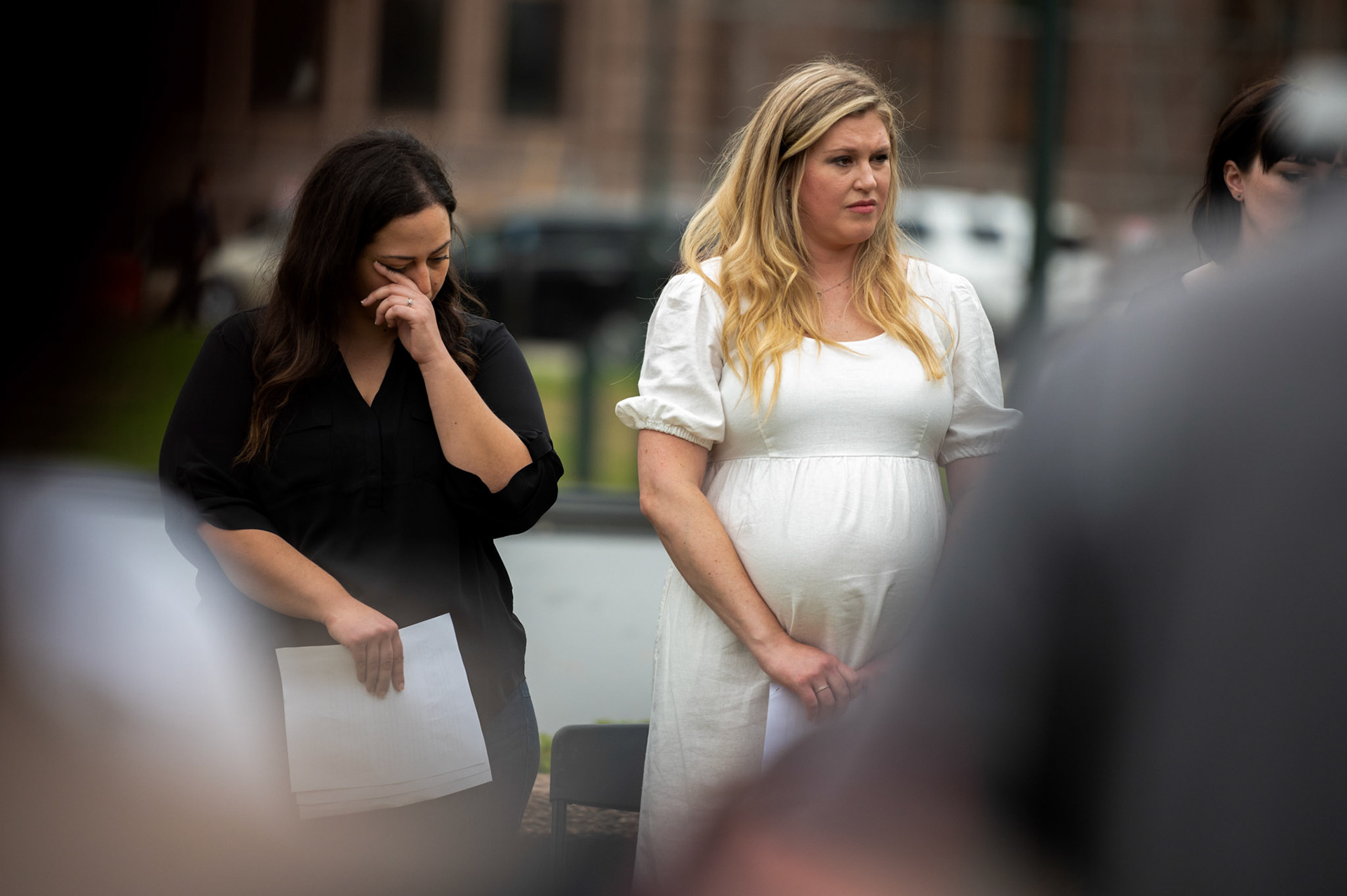 Anna Zargarian and Lauren Miller, two of five plaintiffs denied abortions in Texas during life-threatening pregnancy complications, during a press conference announcing the filing of Zurawski v. Texas at the Capitol on March 7, 2023. Seven plaintiffs, including two OB-GYNs, demand a declaratory judgement from the state on what constitutes a “medical emergency” exception to abortion bans.