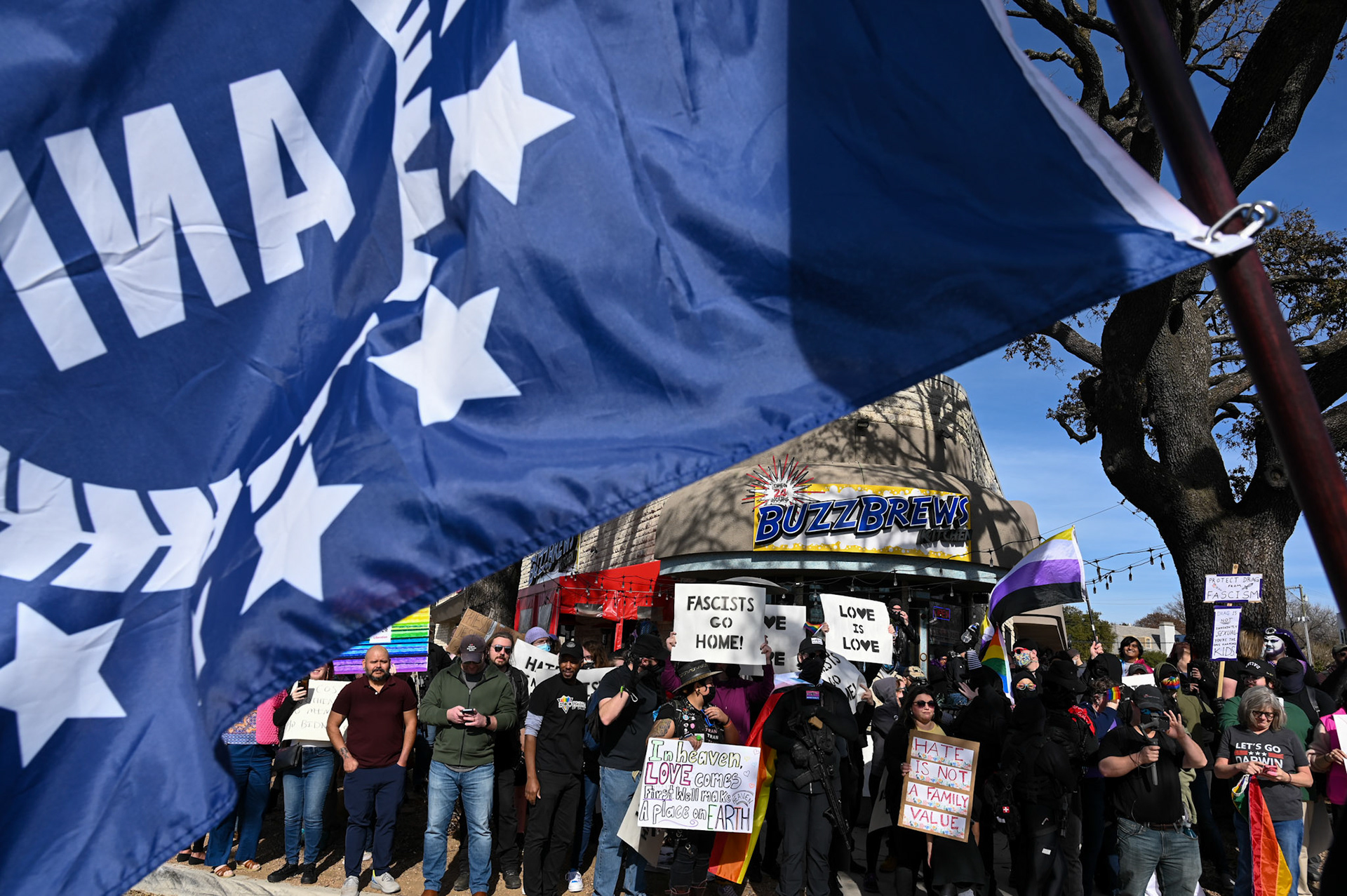 Members of the American Nationalist Initiative and other anti-drag protesters stand opposite of drag show supporters in Dallas, TX on Jan. 14, 2023.