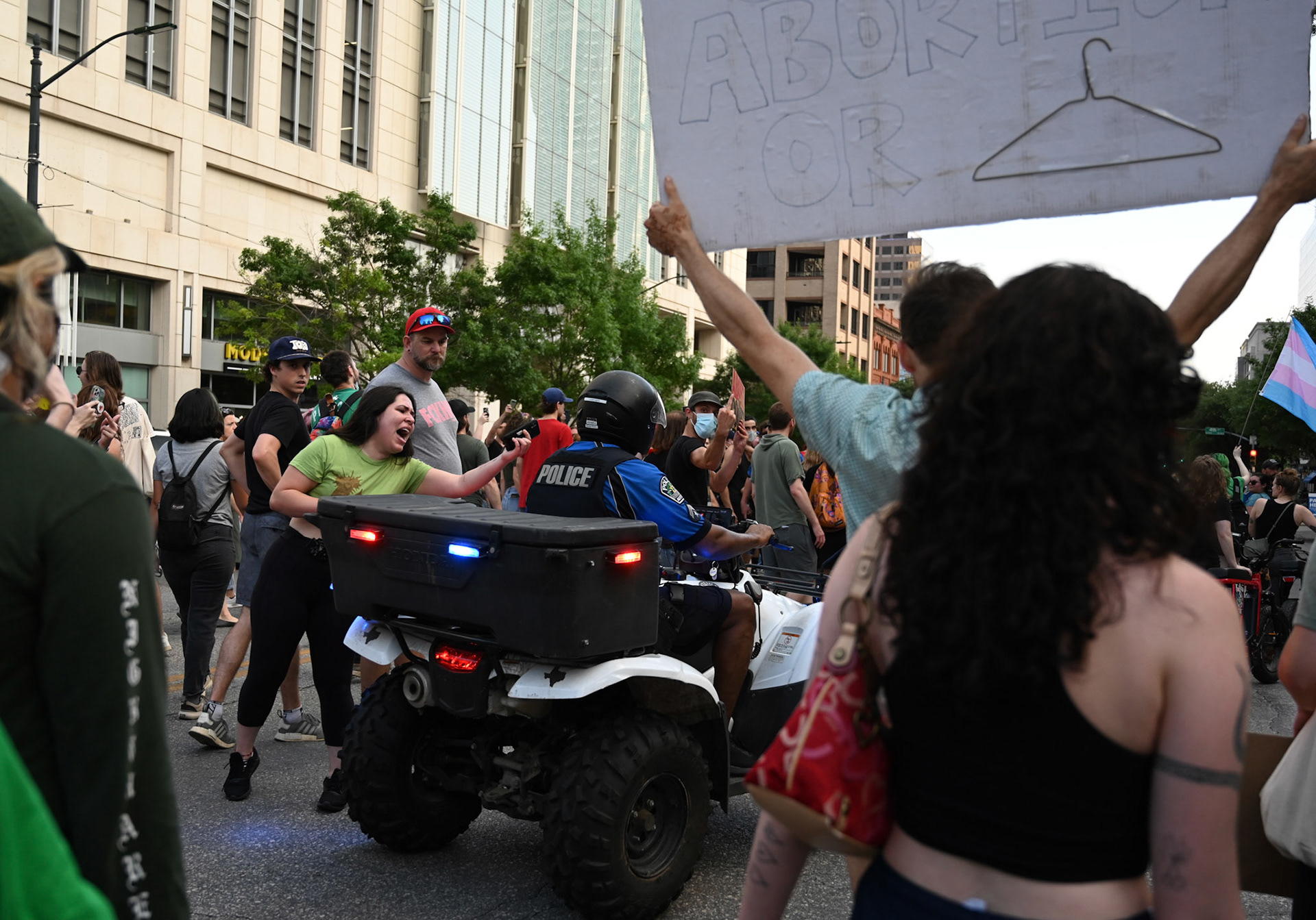 A protestor shouts after a policeman on Congress Ave., on May 3, 2022. While walking back from the Capitol, protestors were corralled off the blocked off streets and onto sidewalks. 