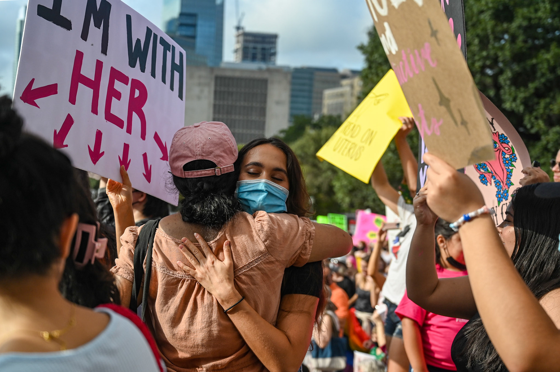 Two friends embrace at the Austin Women’s March on October 2, 2021. 