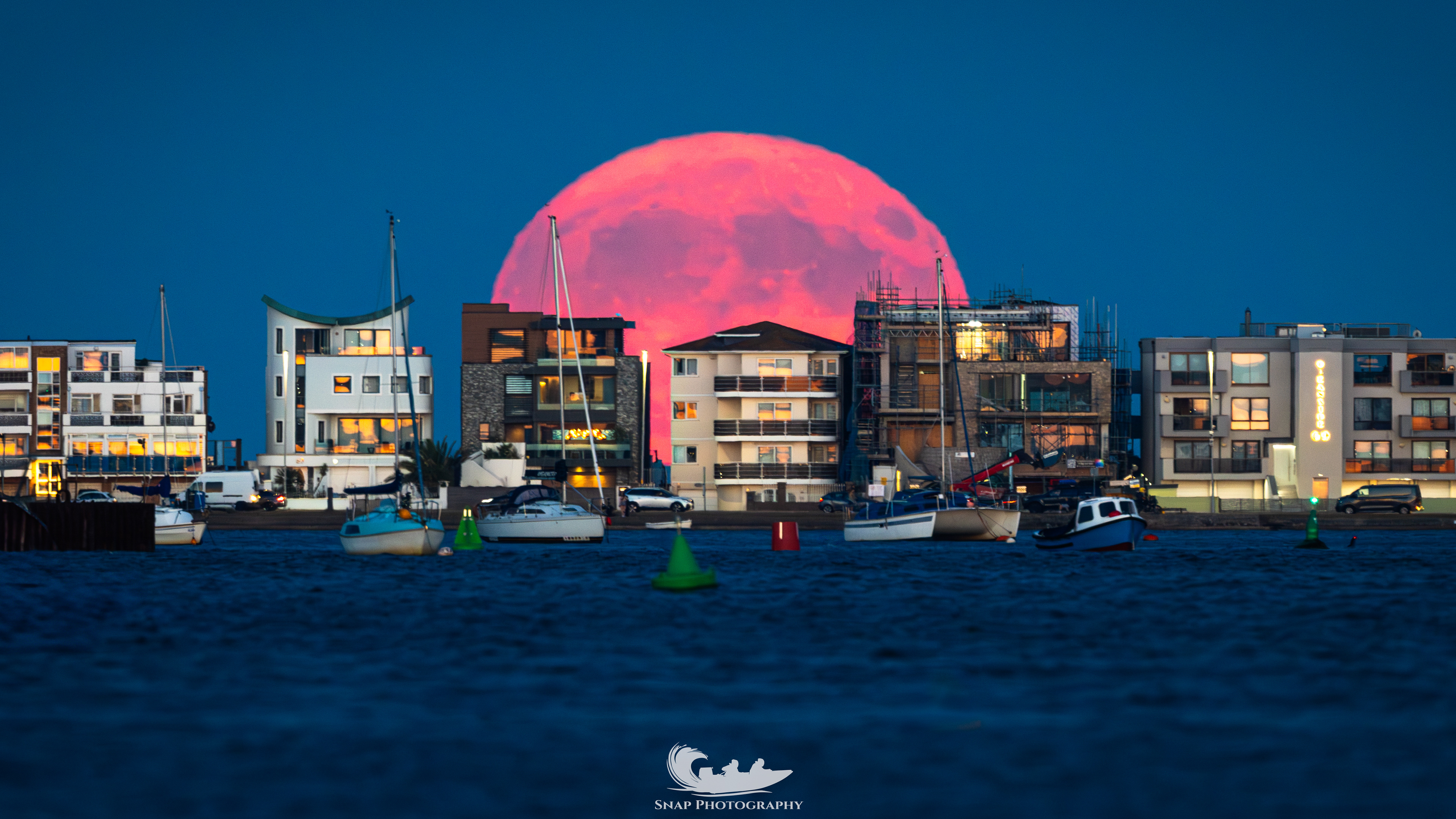Buck moon rising over Sandbanks