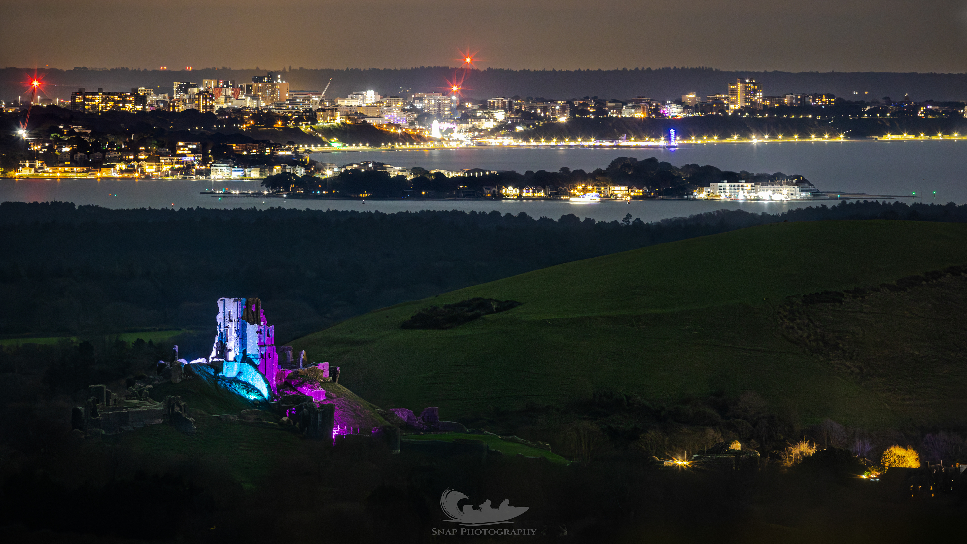 Corfe castle with Bournemouth pier 14 miles away