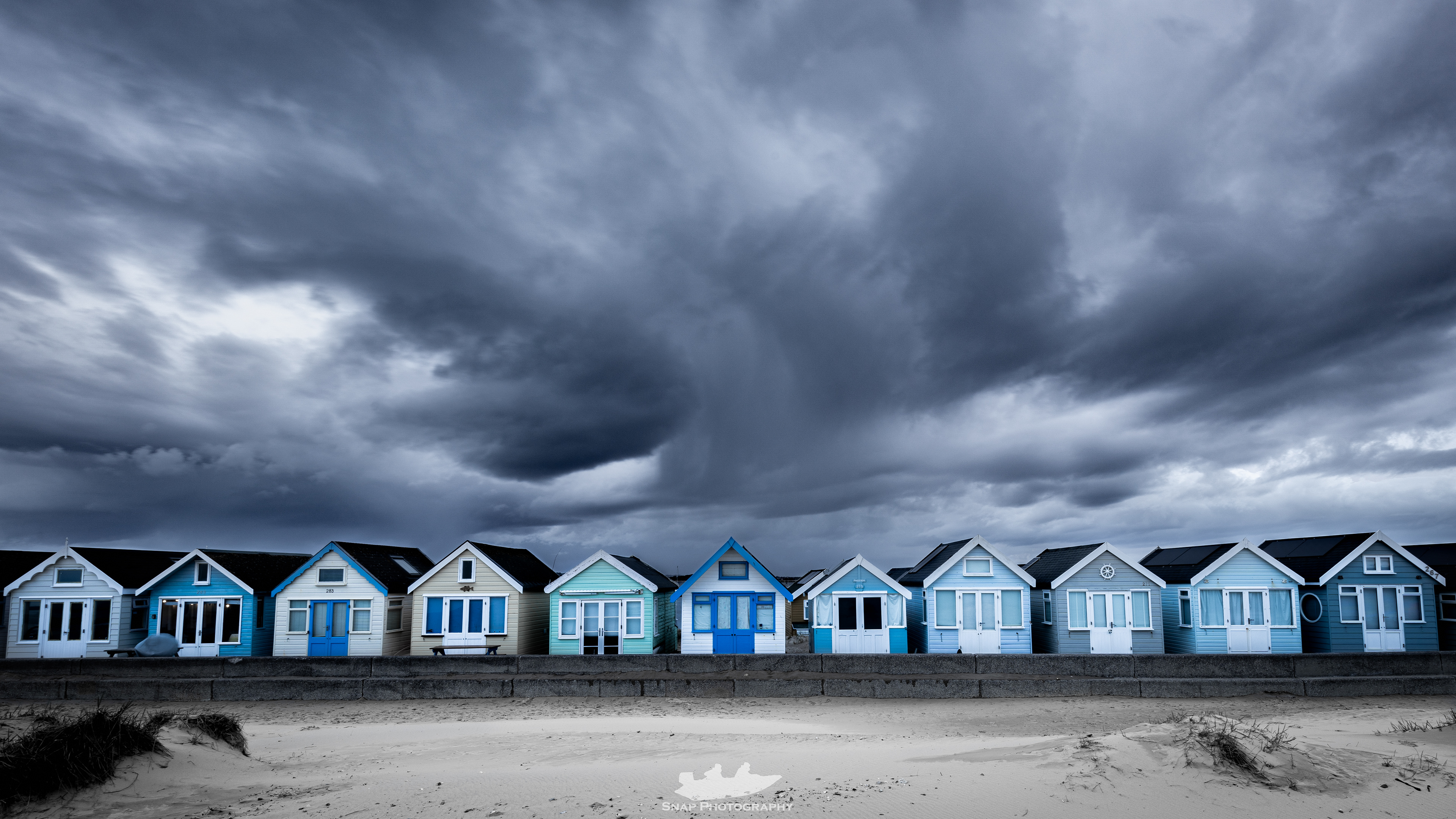 Dramatic skies over the Hengistbury Head beach huts