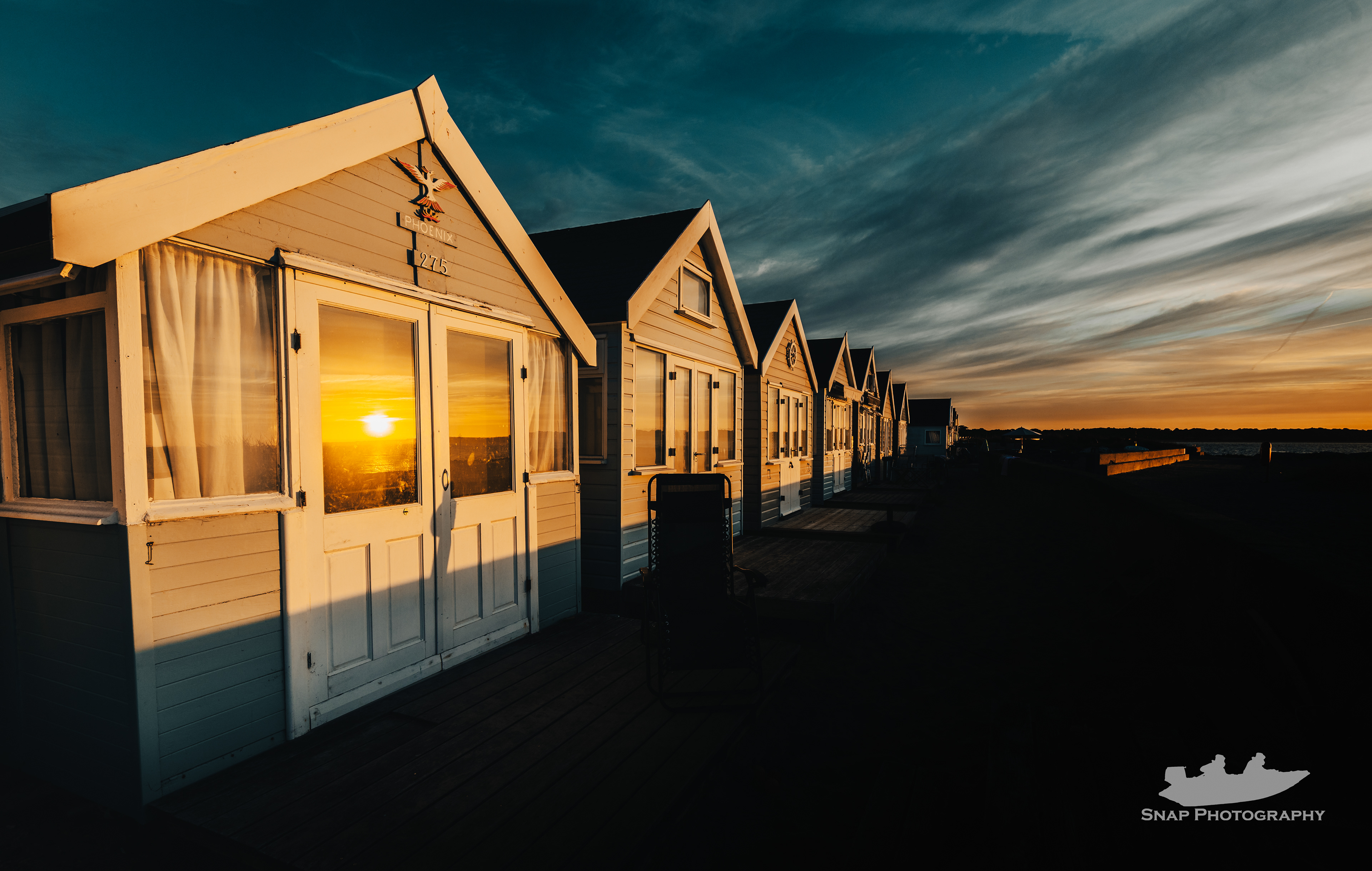 Beach huts at sunrise