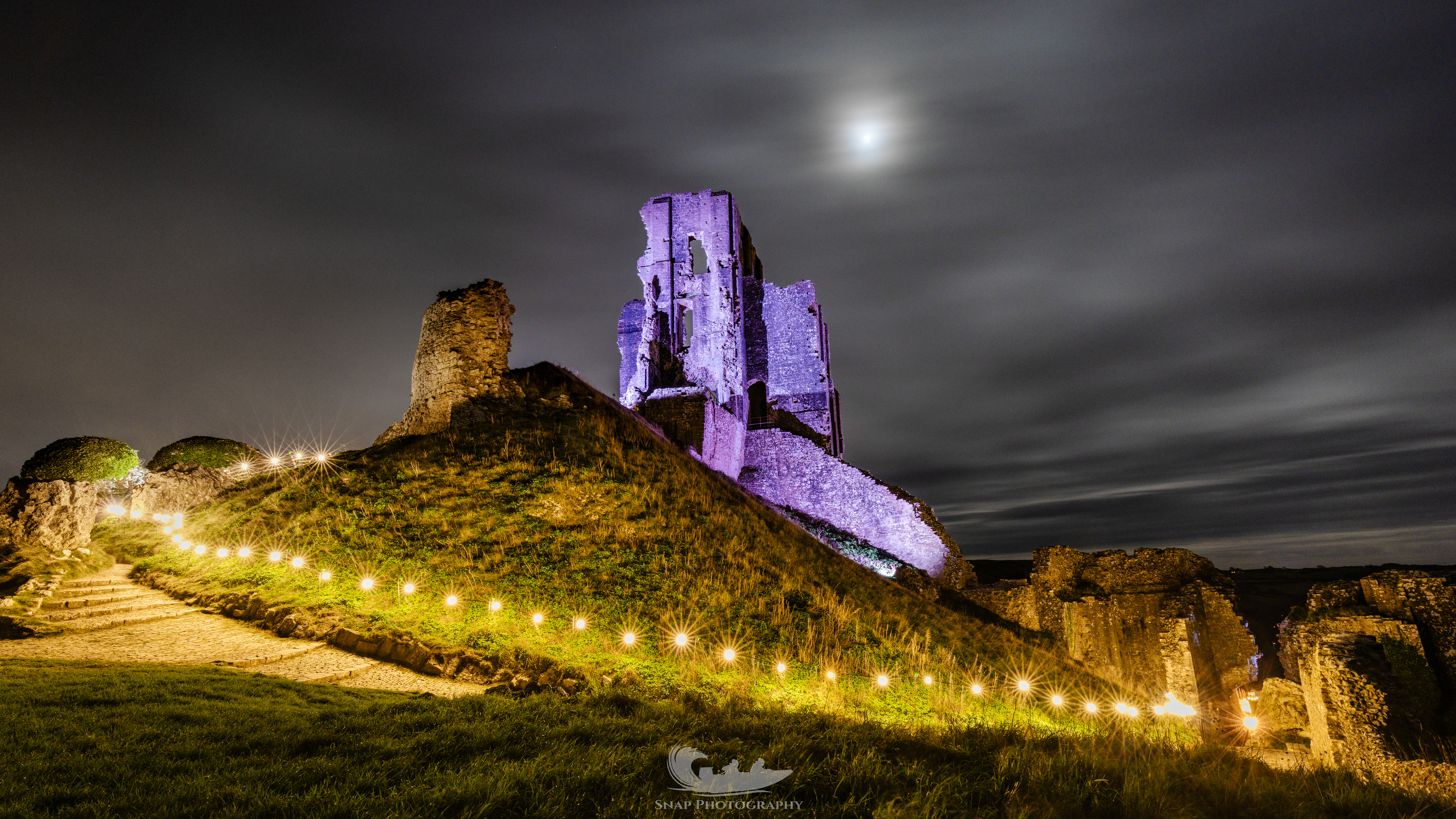 Corfe castle lit up for Christmas