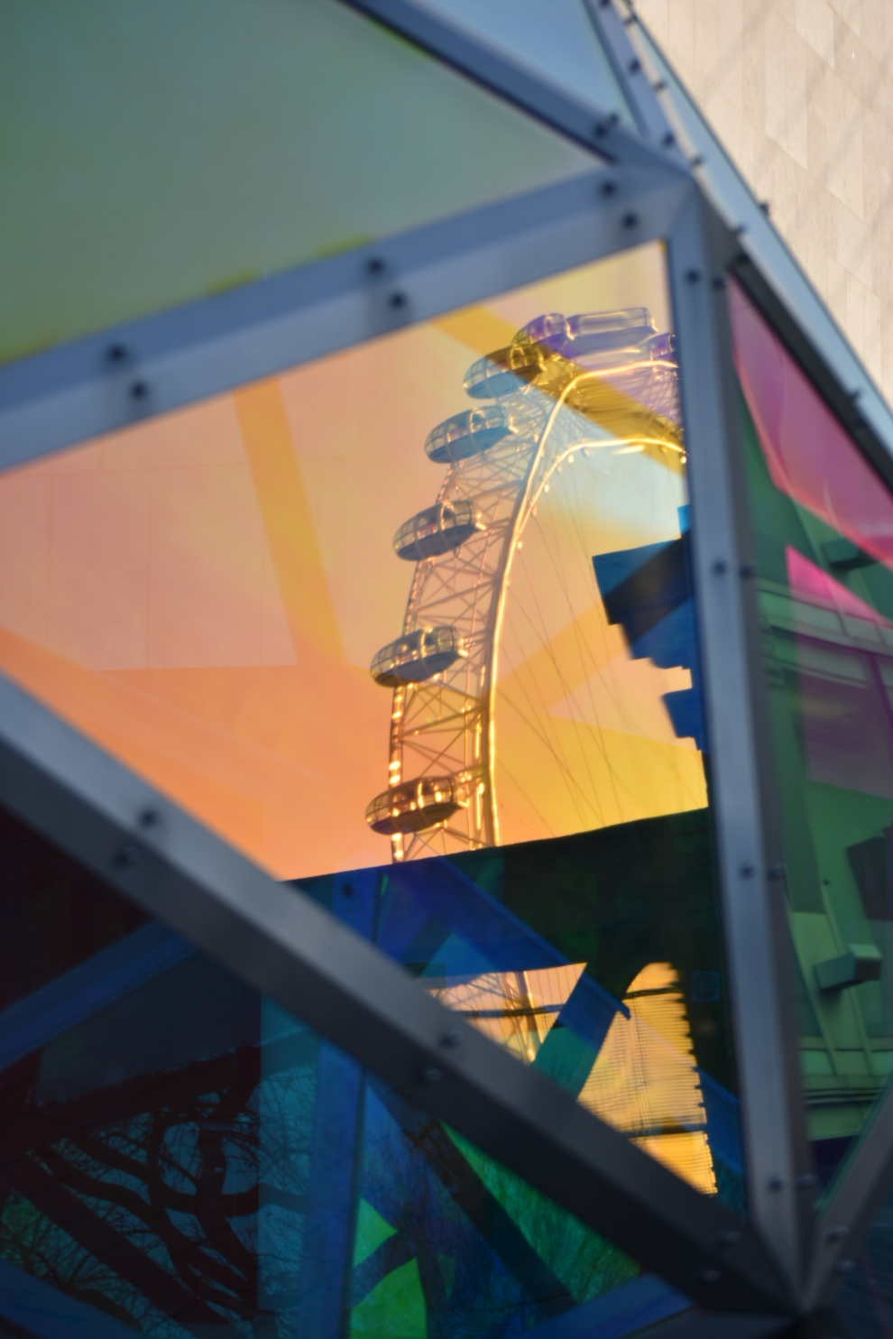 The London Eye reflected ina. dichroic sphere, South Bank