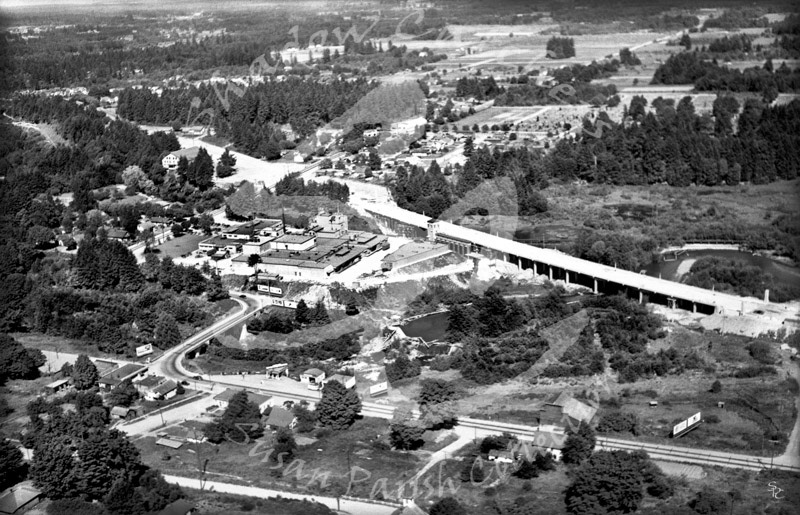 AERIAL OVER OYMPIA BREWERY COMPLEX AND NEW BRIDGE OVER THE DESCHUTES RIVER