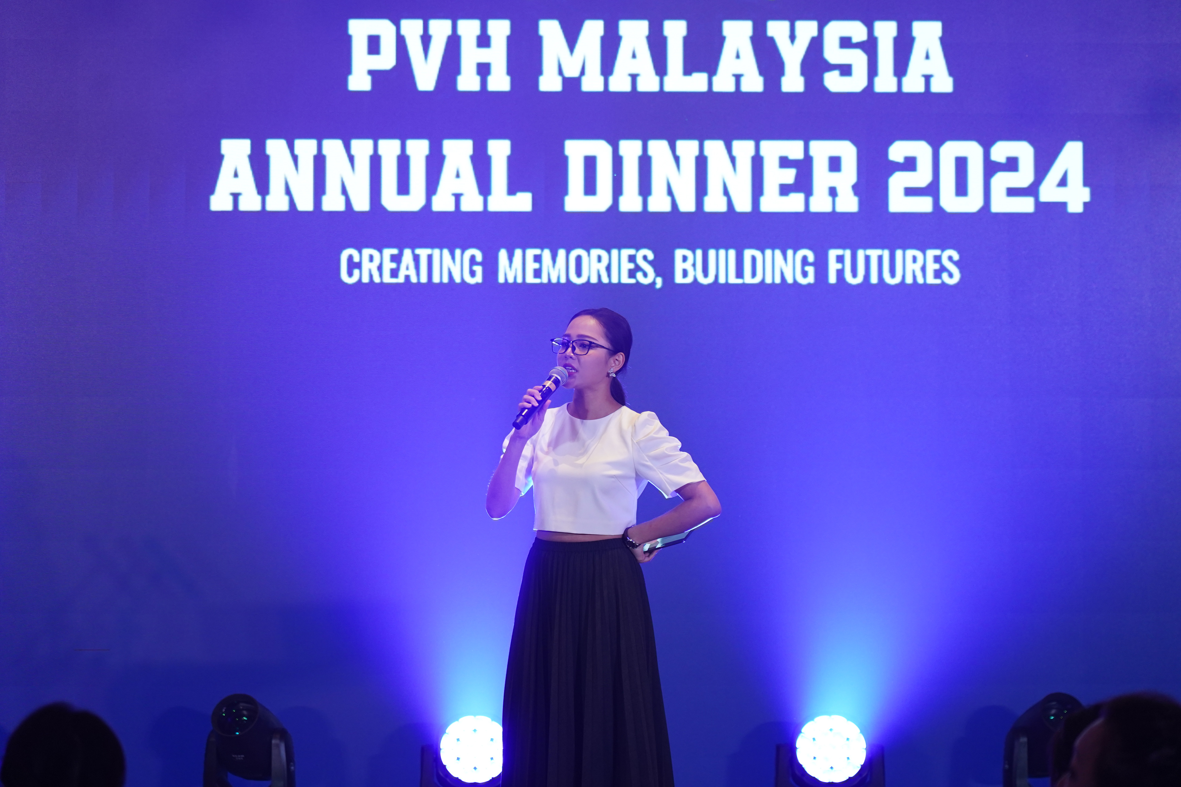 Emcee opening a Back to School-themed dinner, engaging the audience with fun and interactive activities.