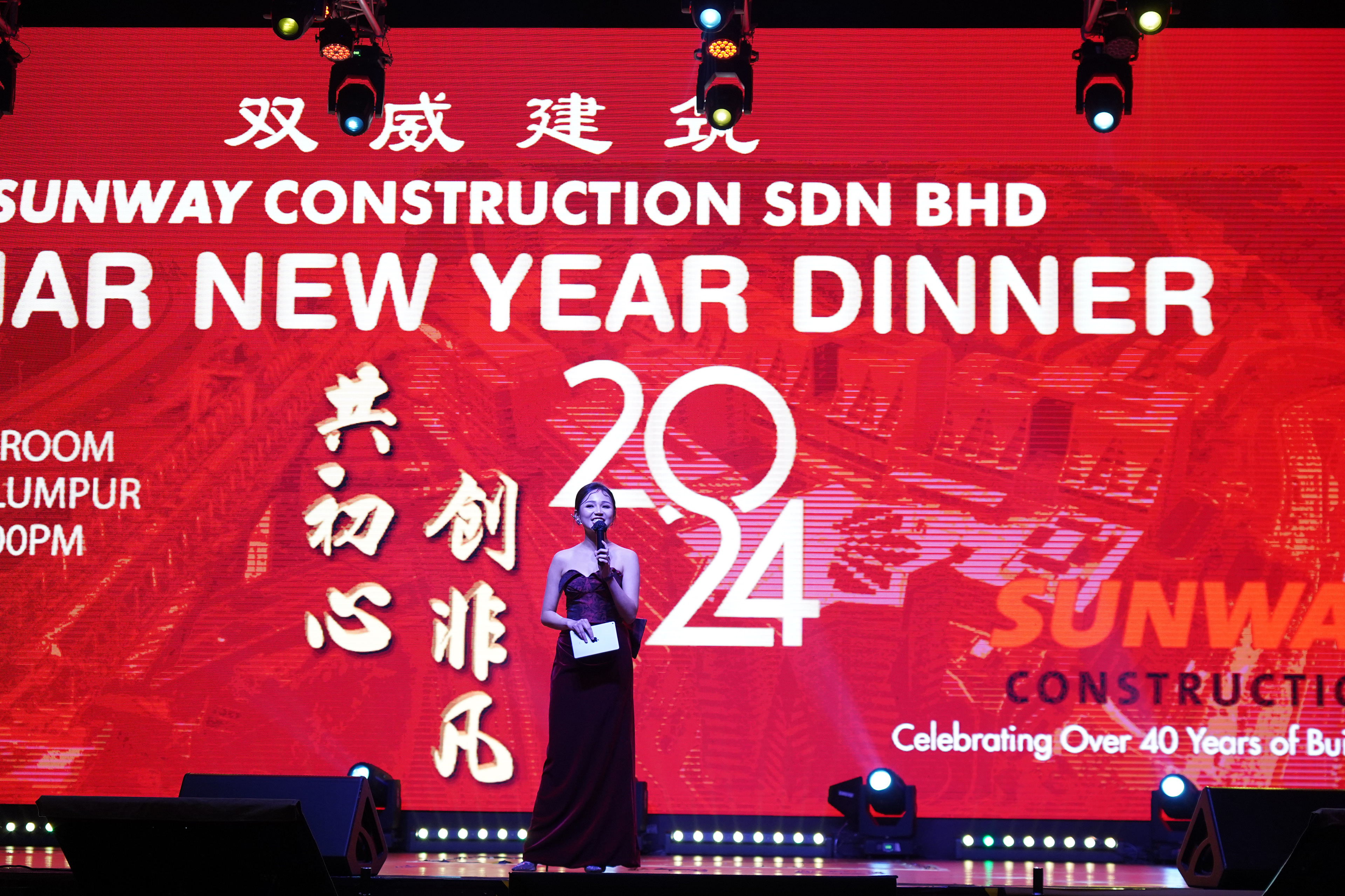 Emcee delivering the opening speech at a corporate appreciation dinner, setting the tone for the event.