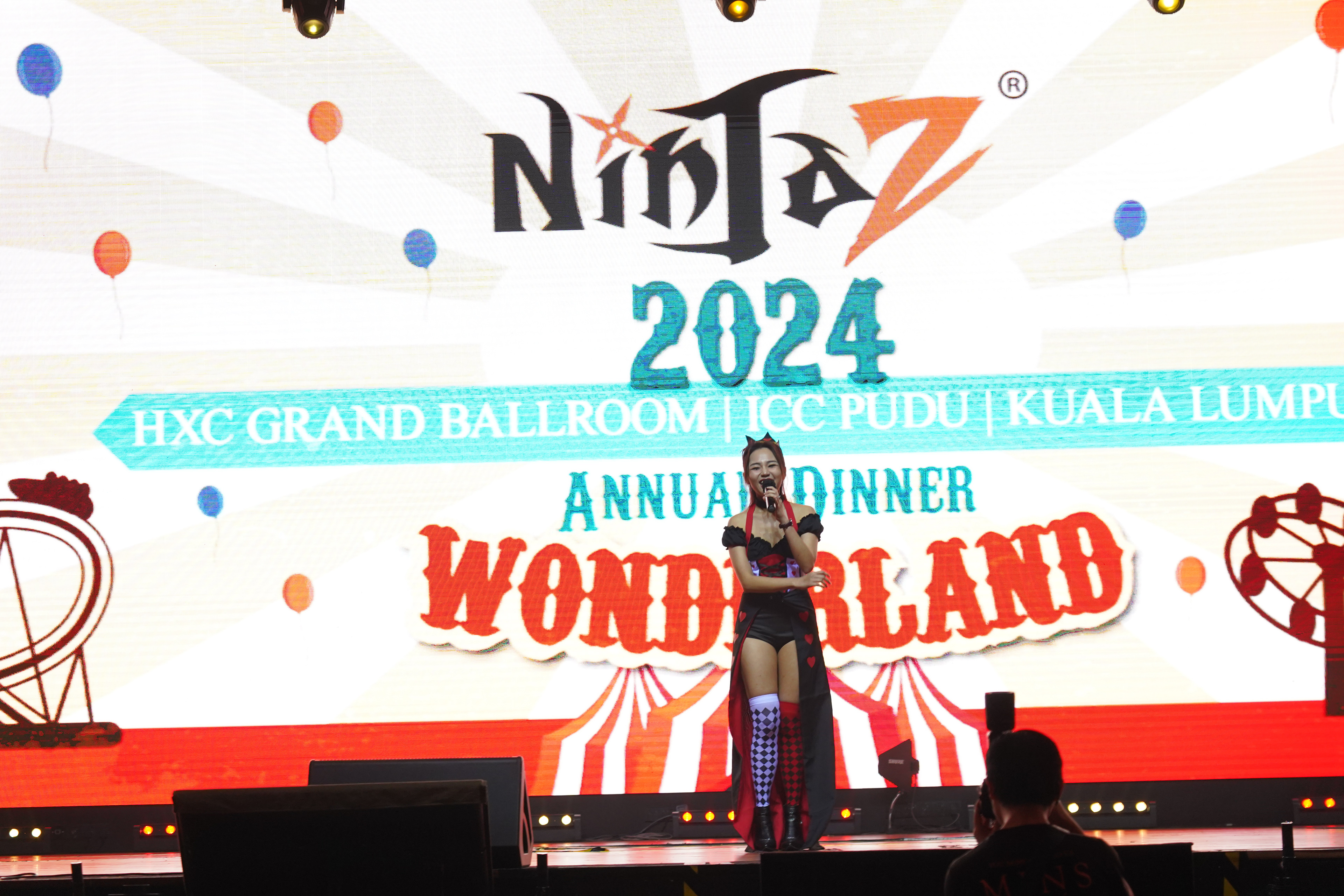 Emcee leading a themed dinner event, with guests immersed in the creative atmosphere.