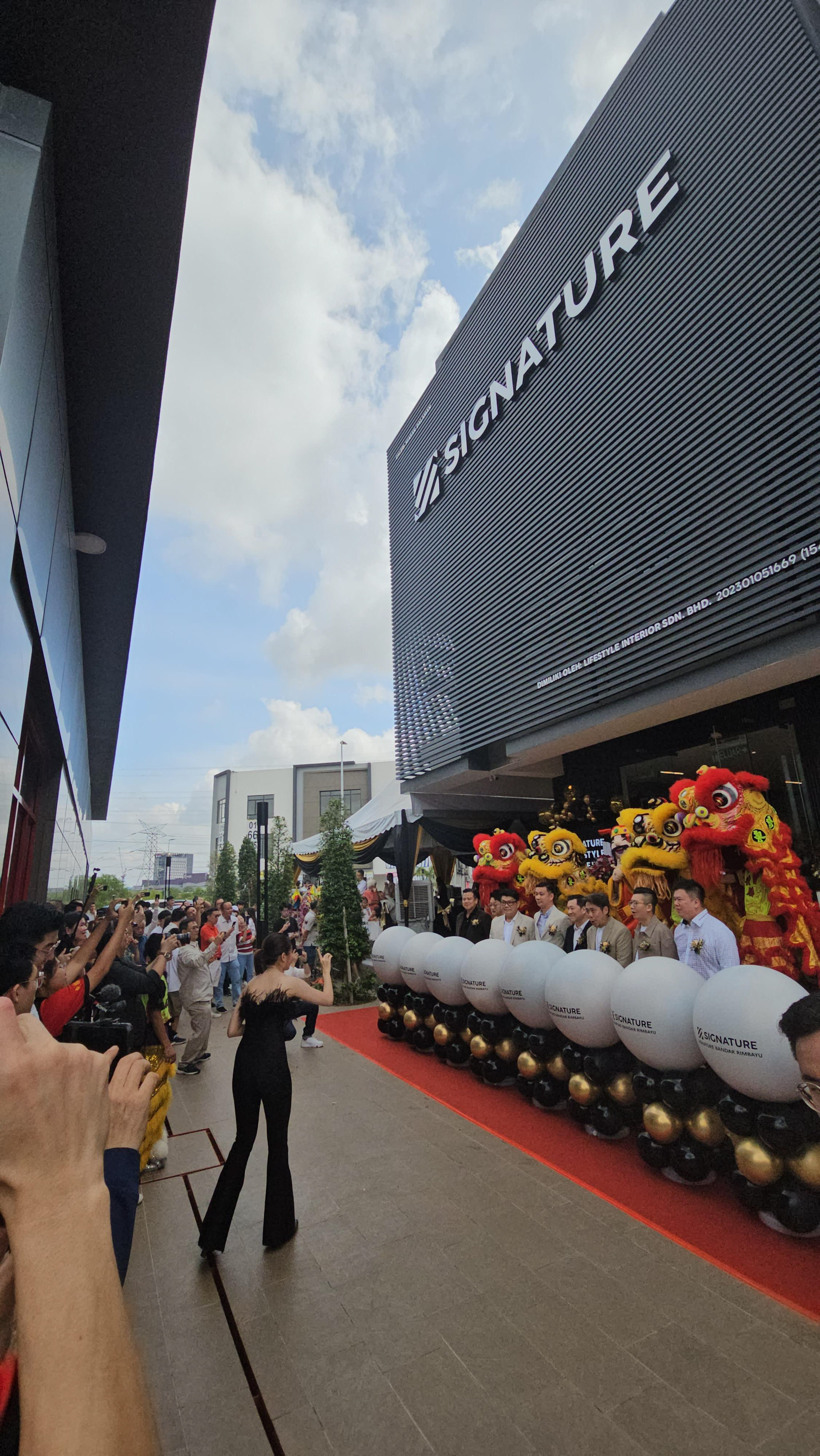 Dynamic emcee leading a grand opening event with ribbon cutting and excited guests