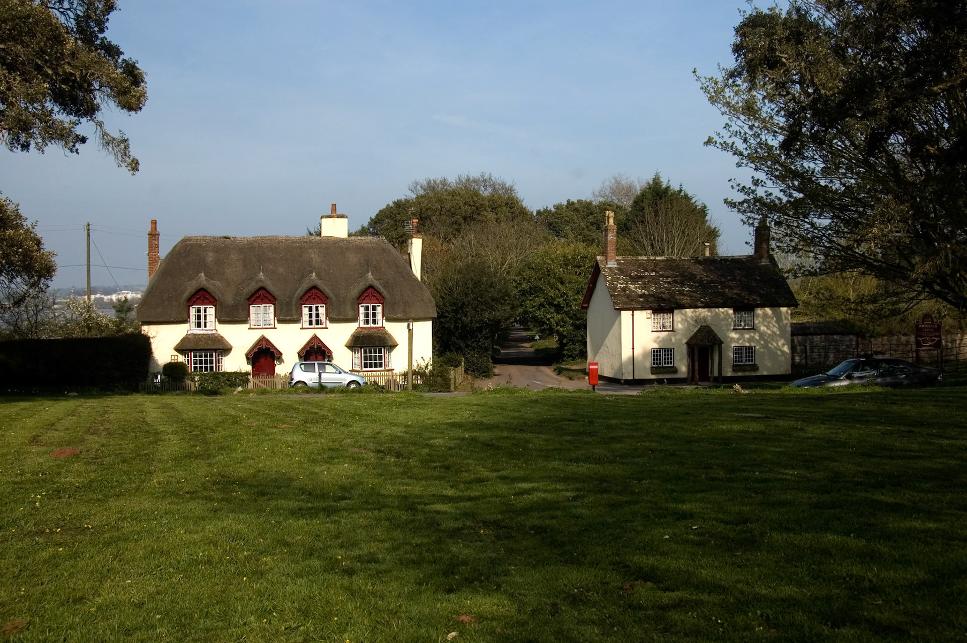 I love these two little cottages just outside Powderham Castle. Steve and I once came very close to ending up in the front room of the one on the left, thanks in part to the very sharp corner between the two and also partly due to some over enthusiastic teenage driving.