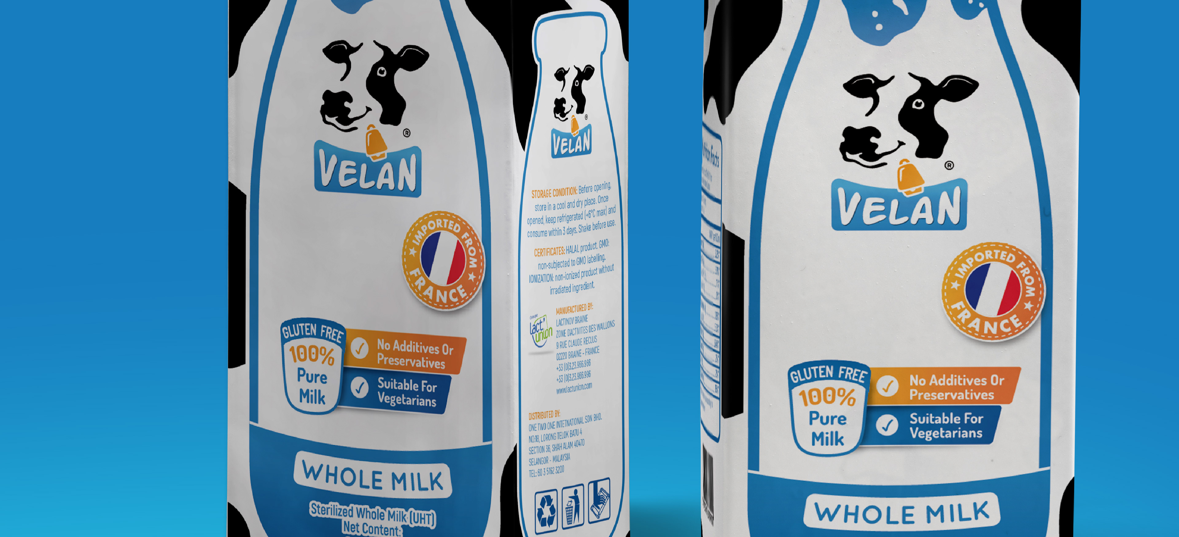 Close-up of two Tetrapak Milk boxes that have a Velan logo. Its visual design is composed of a milk jar, blue and black are the primary colors with a pinch of orange.
