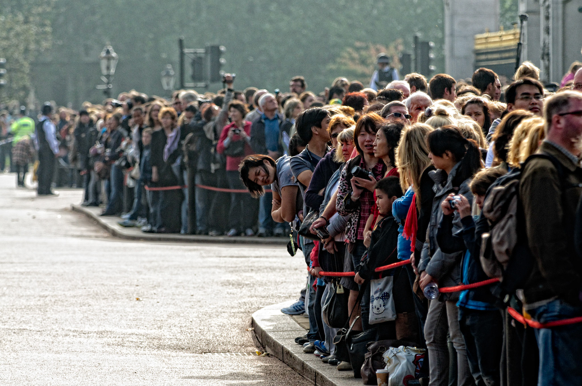 Awaiting the mounted guards, Buckingham palace, London UK.