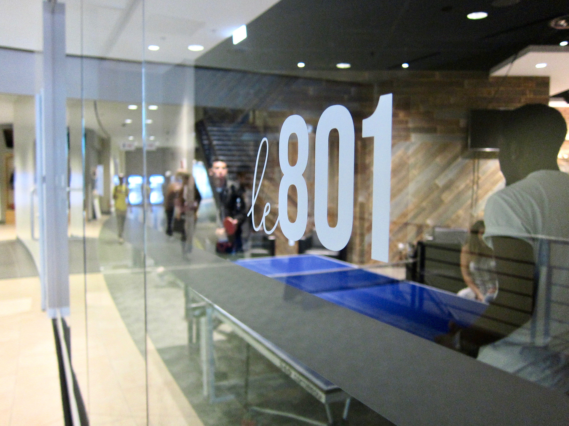 Le 801 logo vinyl on a window outside the restaurant.