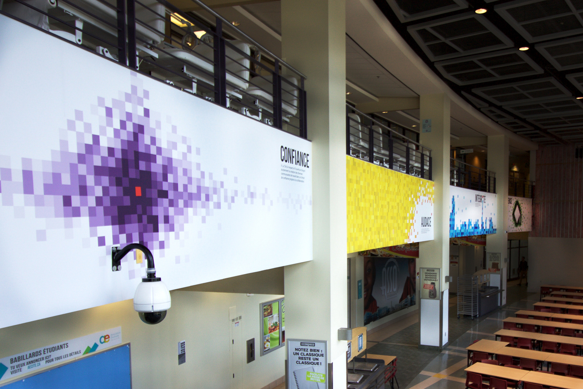 All four vinyls on a wall in the cafeteria.