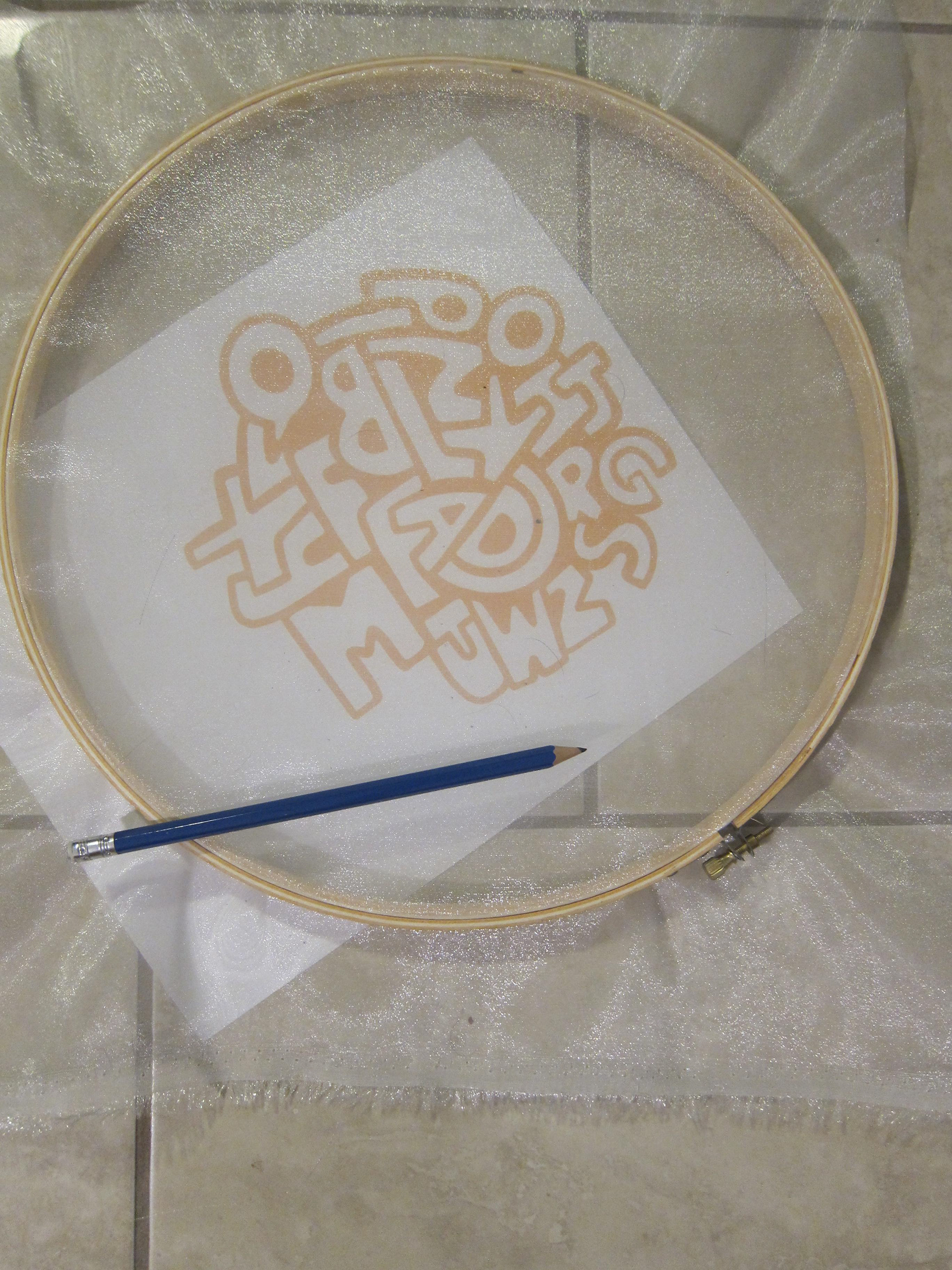 Tracing the design onto organza fabric