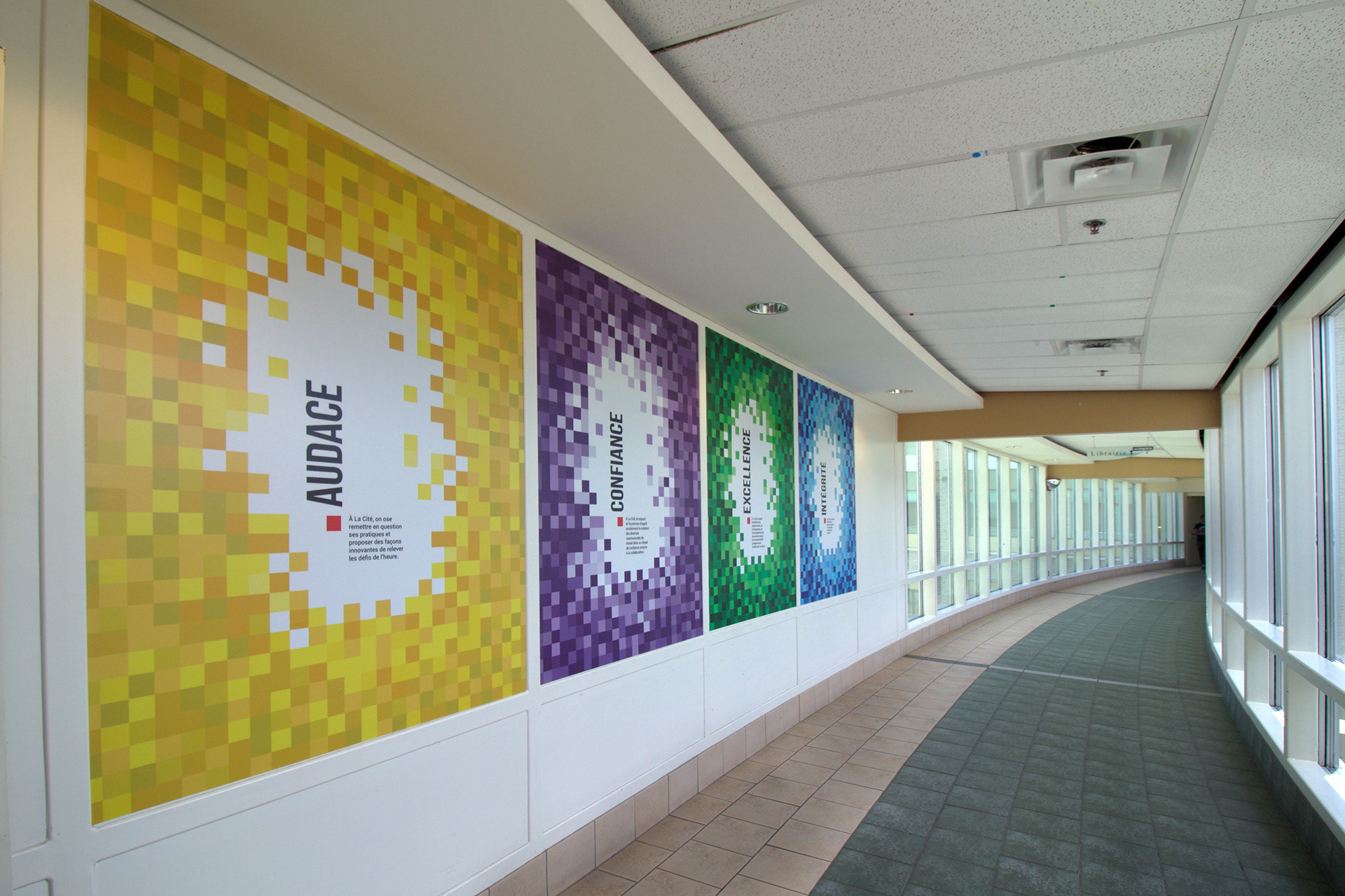 All four vinyls on a wall in a hallway.