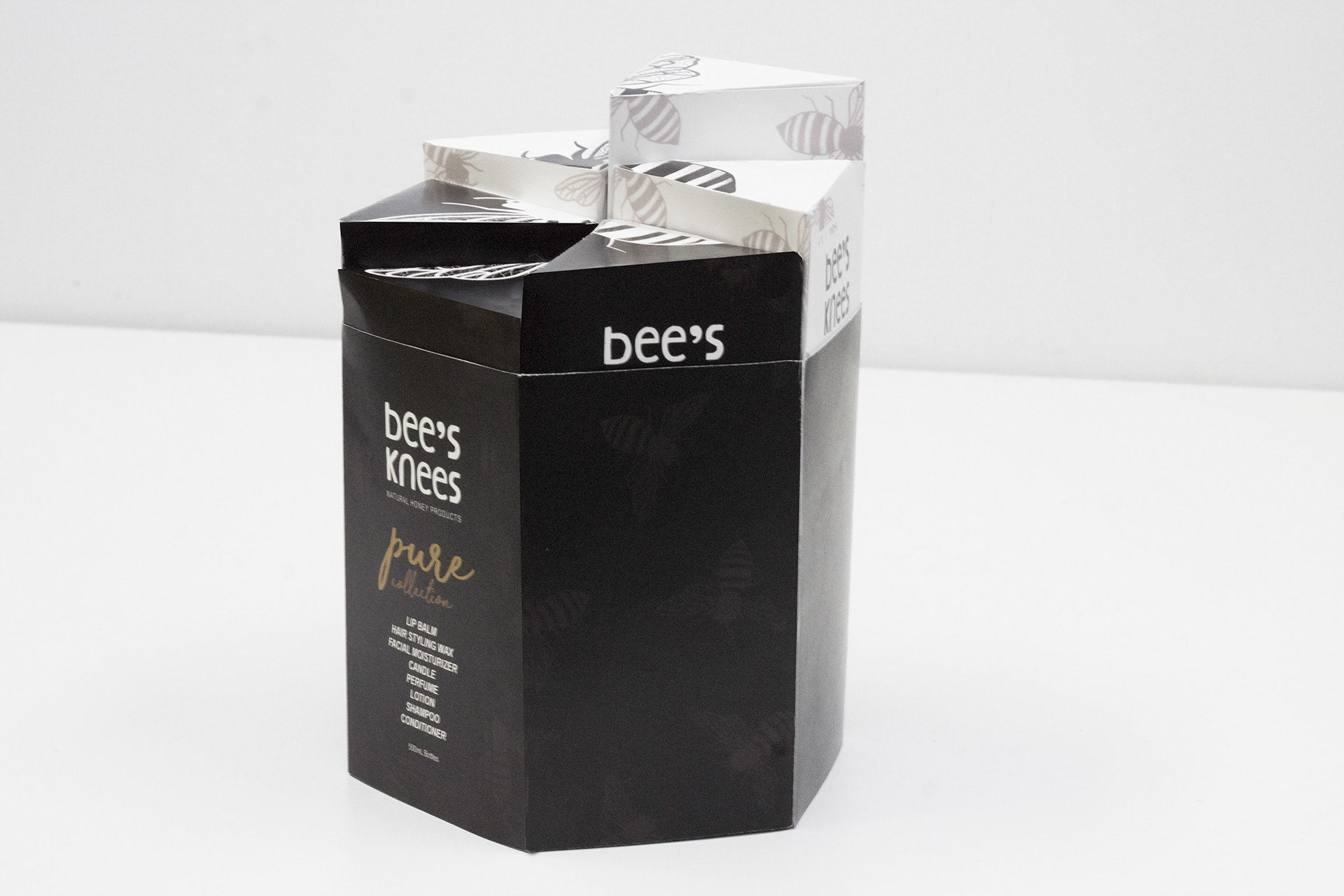 Front side view of stacked packaging with exterior sleeve.
