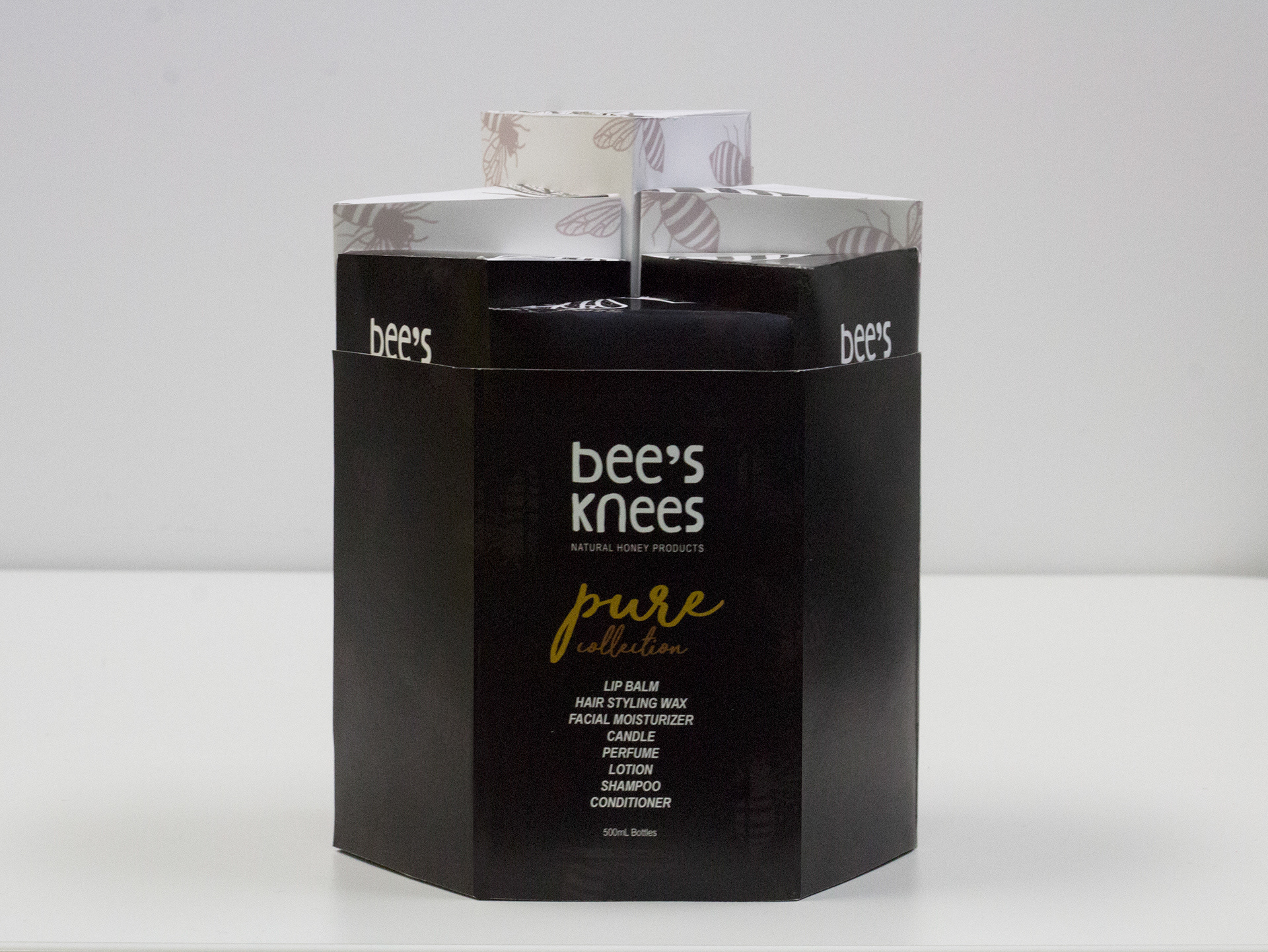 Front view of stacked packaging with exterior sleeve.