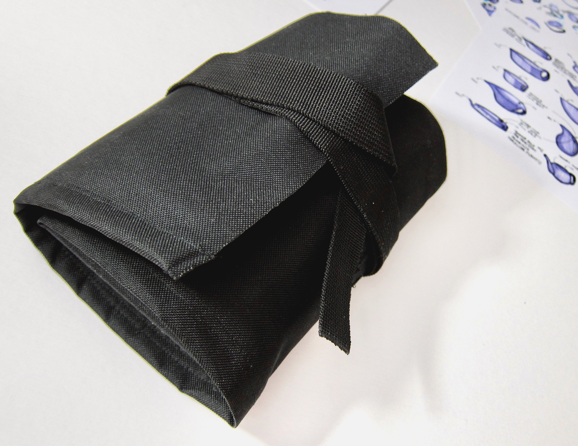 Pencil case rolled up with strap