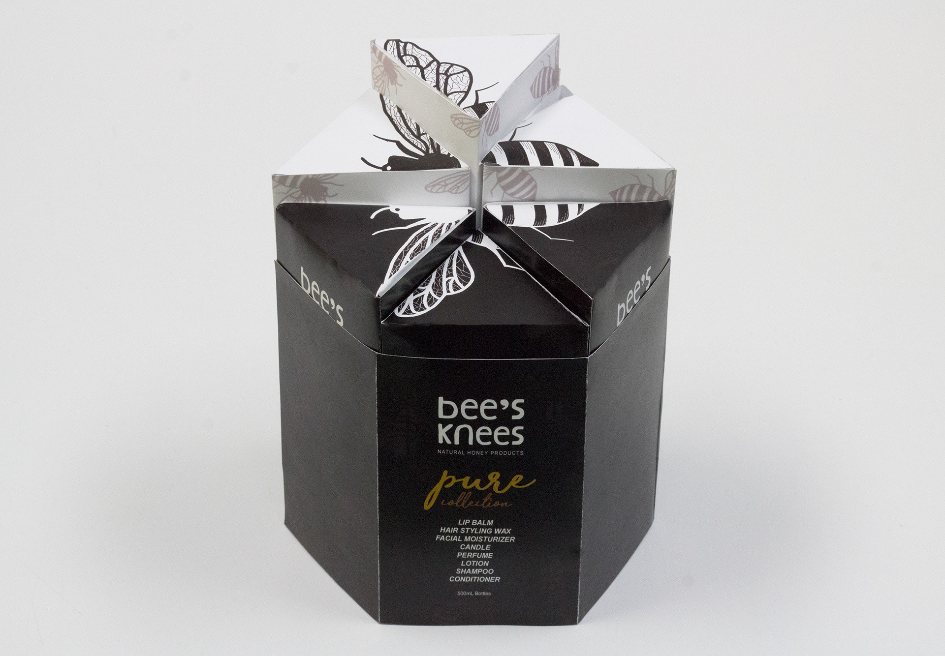 Front top view of stacked packaging with exterior sleeve.