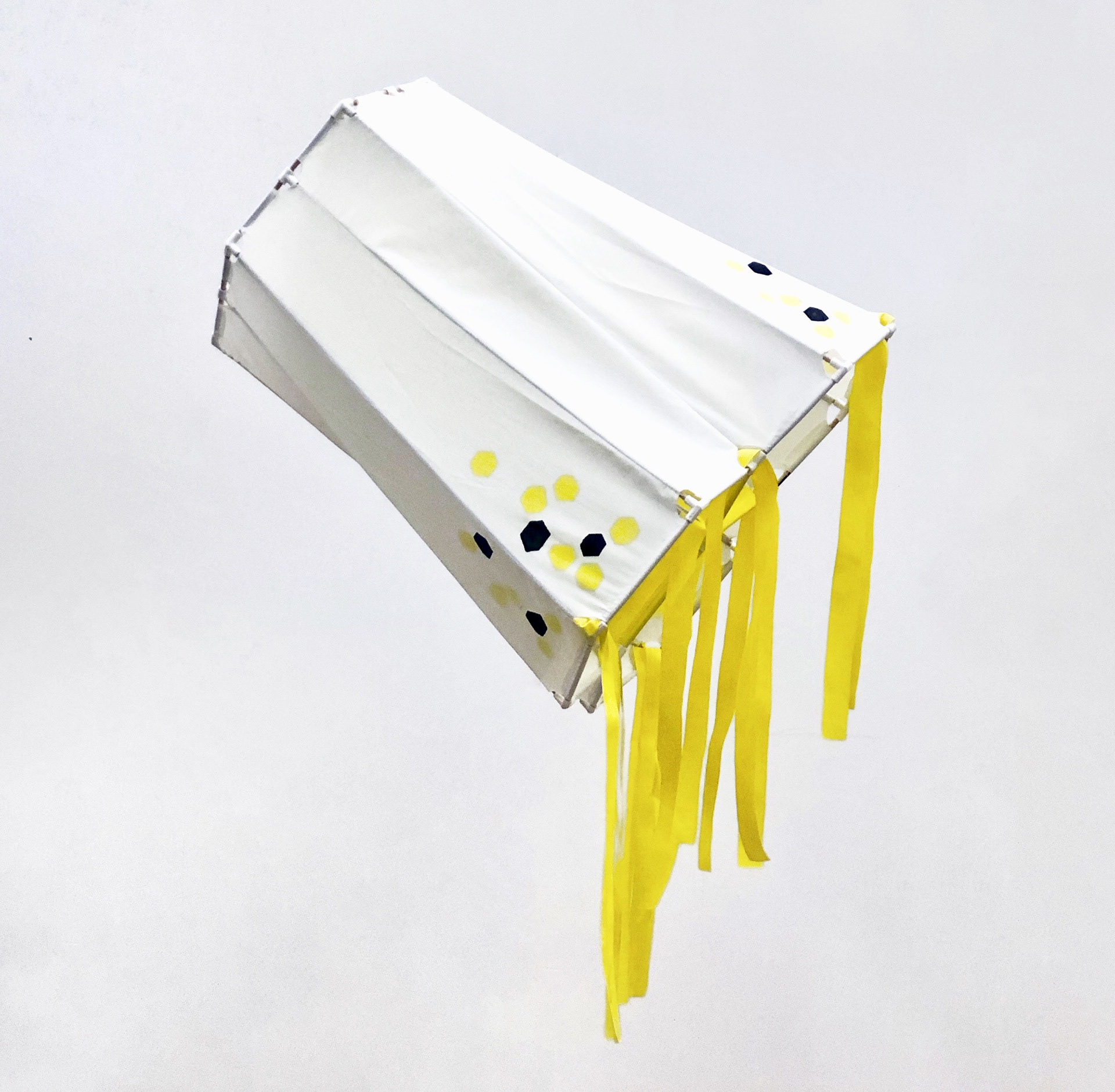 Side view of the hex kite hanging from the ceiling.