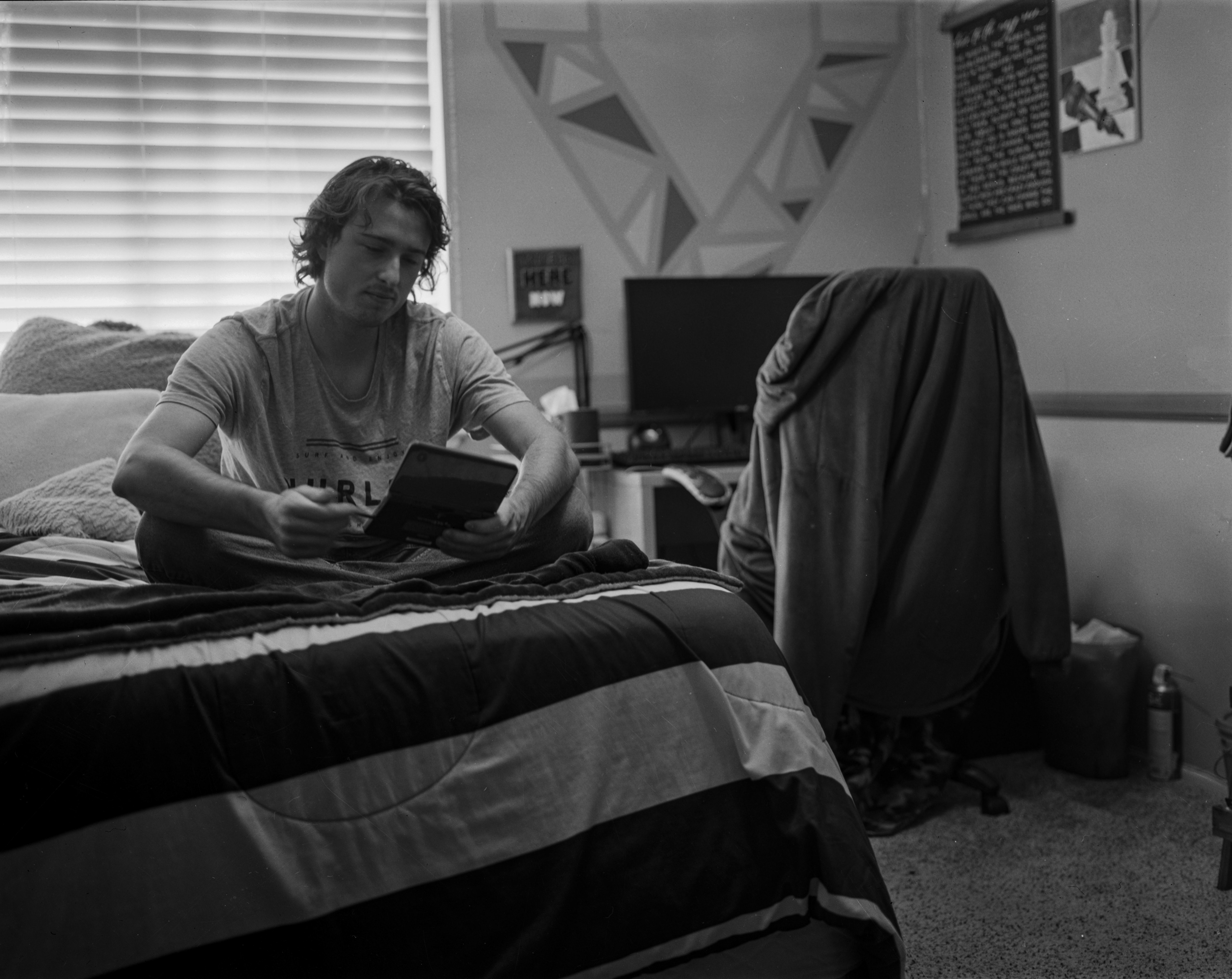 Thomas Joseph Dignan V - His Nintendo DS is more of a hard drive than a gaming console. Here he holds photos of a friend he hasn’t had contact with since Elementary, as well as photos of his late grandparents. The SD card port is damaged so the photos can only live here.