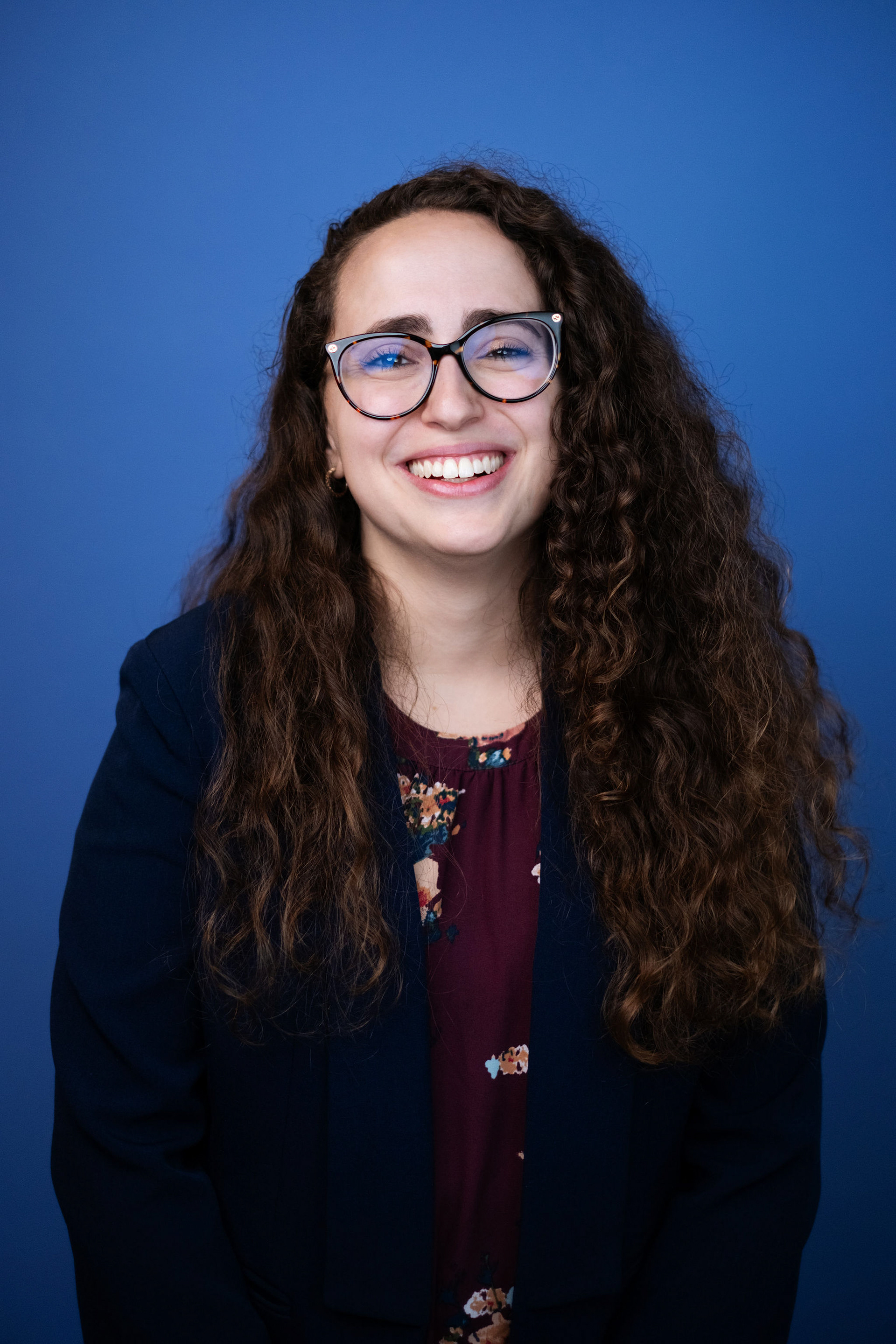 Professional headshot with studio lighting and neutral backdrop, NYC