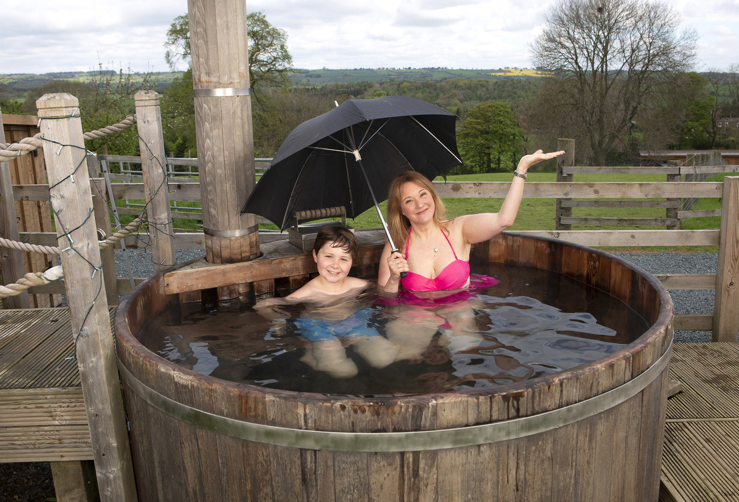 Jo Biker and her son William enjoy their wood fired hot tub. Daily Mail
