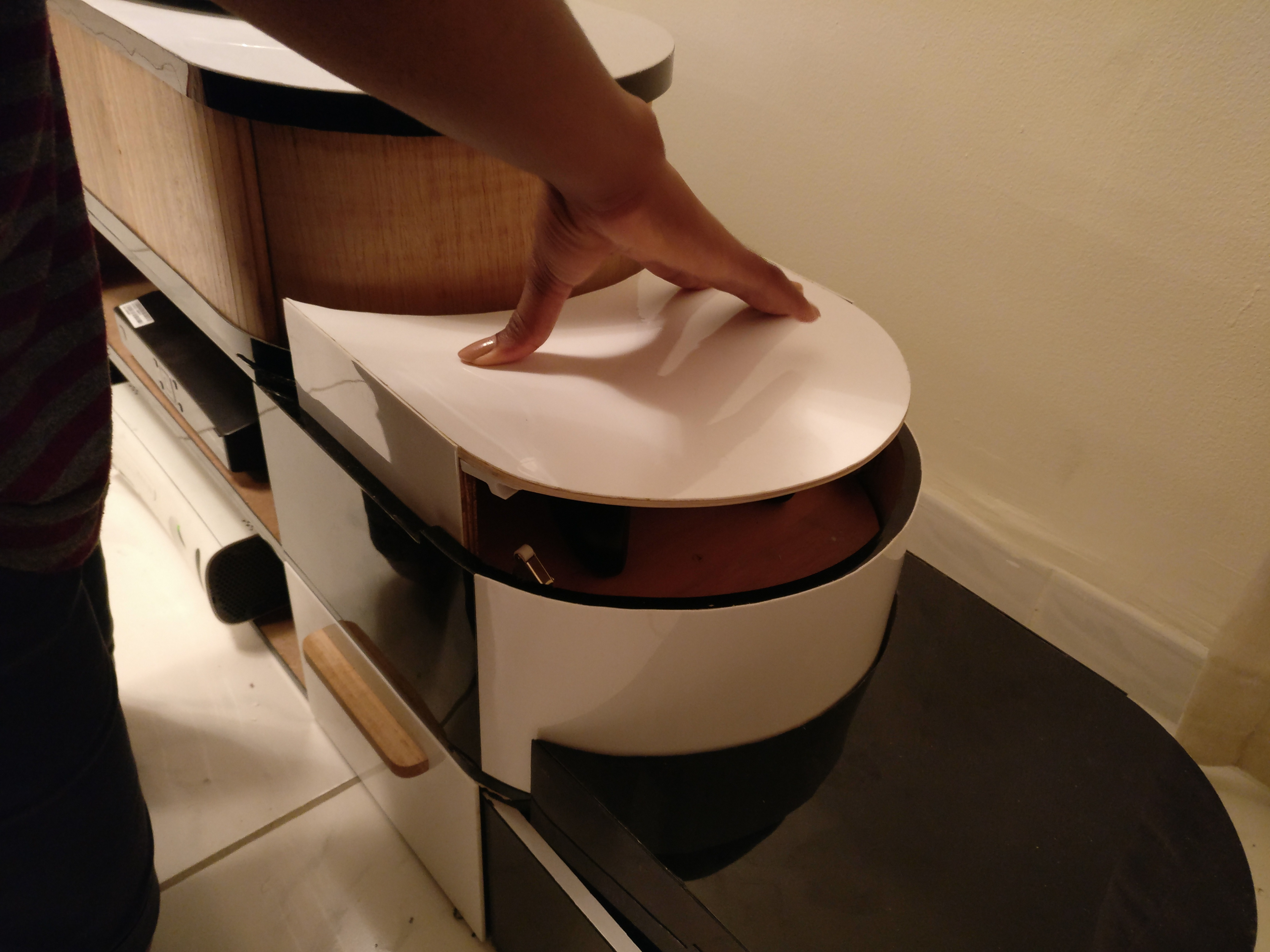 Pop up storage could hold remotes or controllers