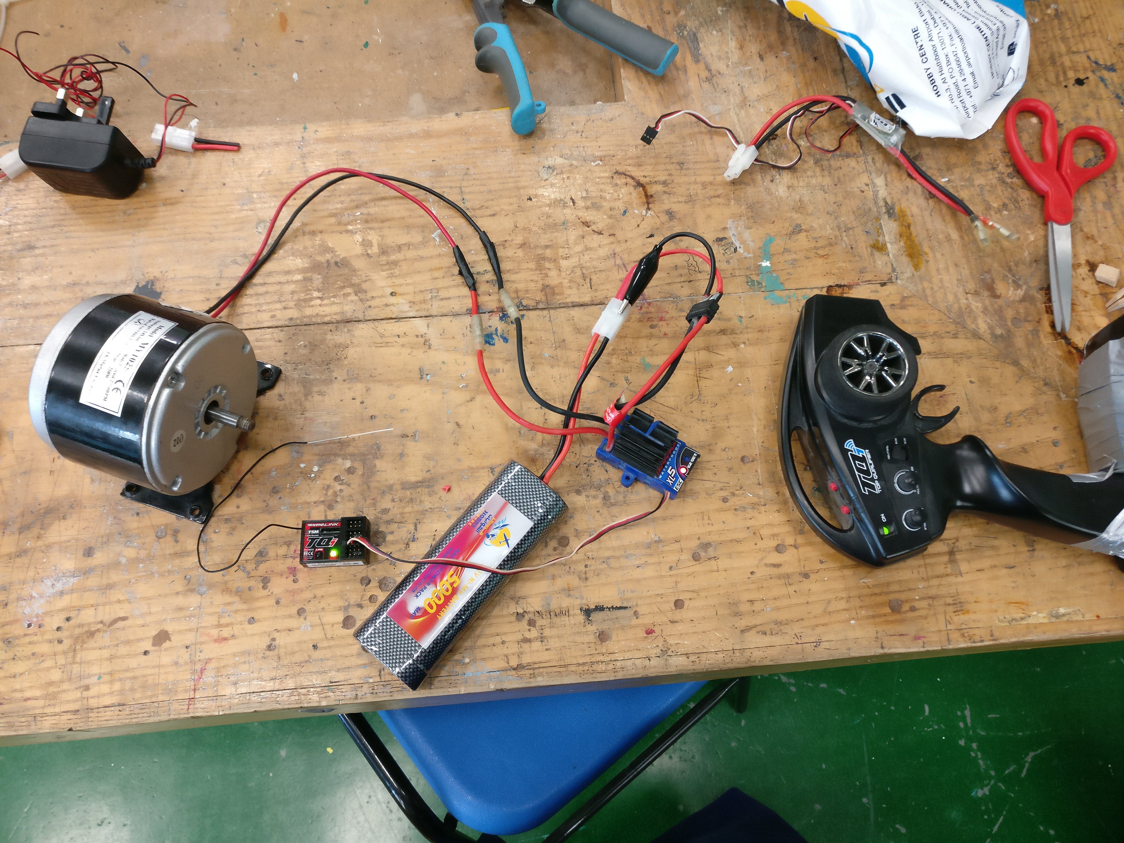 The electronics: A motor, an ESC, a receiver, and transmitter from the remote
